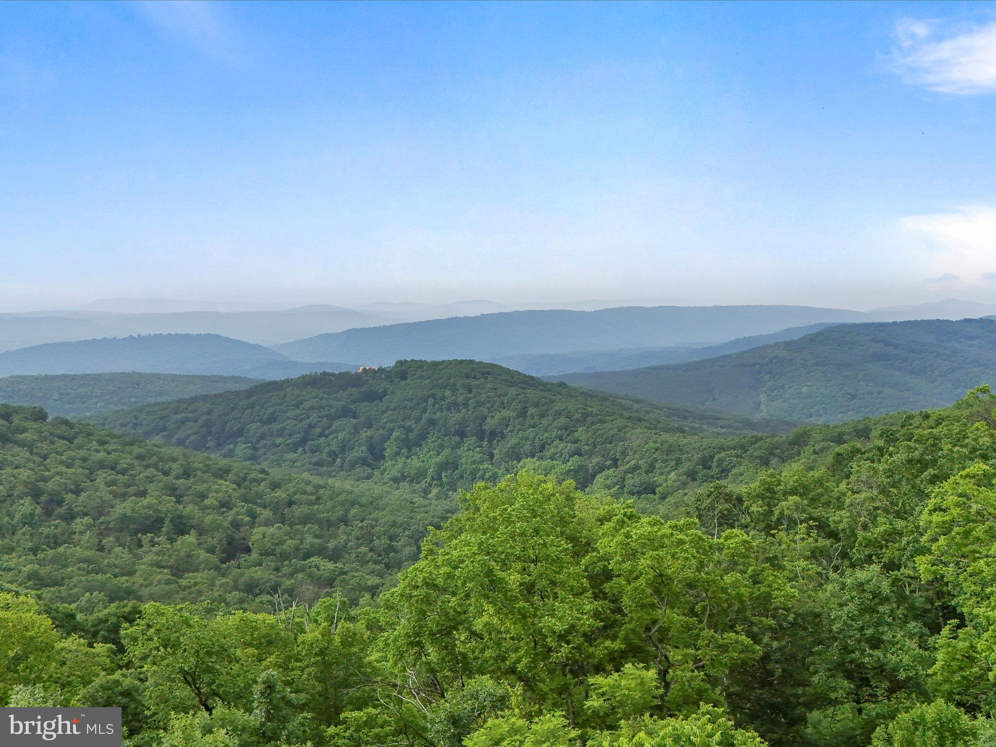 COME FOR THE SOLITUDE. STAY FOR THE VIEWS!
Nestled in a private, gated community, this hidden gem is the perfect escape for those seeking both adventure and tranquility. With miles of roads to explore on your ATV, this property offers the ideal balance of seclusion and excitement. But the real magic? The stunning views that surround you.
NATURE AT YOUR DOORSTEP: Private River Access – Enjoy exclusive access to a private common area on the south branch of the Potomac River. Whether you are kayaking, tubing, or just soaking in the serenity, the river is your playground. OUTDOOR ADVENTURE: Beyond the river, the property offers diverse terrain perfect for ATVing, hiking, and wildlife observation. A custom-built "Tree Blind" on-site allows you to get up close to deer, turkey, and even the occasional bear.
THE COZY CABIN: The cabin itself is a charming retreat, offering comfort and rustic appeal with incredible views from every angle.
CONVERTED SHED: A unique feature: The shed has been transformed into an additional bedroom with a full bath, providing extra space and privacy for guests or family members.
THE PERFECT GETAWAY: Whether you are looking to unwind in solitude, enjoy outdoor adventures, or simply take in the beauty of the area, this property has it all. Bring your kayaks, tubes, or just your love for nature — and make memories that will last a lifetime.