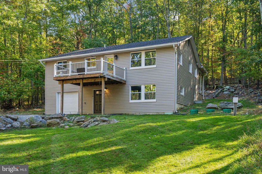 Beautifully remodeled 4 bedroom, 3 bath home sitting on a large secluded  treed lot.  Everything is this home is only a few years old including the roof, HVAC, Appliances, Plumbing, Electrical etc.  Fresh paint throughout the entire home.   The open concept upper level  has wood flooring throughout and an absolutely gorgeous kitchen with stainless steel appliances and granite countertops.  Enjoy relaxing in front of the cozy fireplace in the Family room .  Watch the sunsets from the trex deck which overlooks a very private treed lot.  The owners suite, ensuite bath, secondary bedroom, additional full bath and a laundry room complete the upper level.  The main level has 2 additional bedrooms and a garage.  The patio at the back of the home is covered and provides more views of the private exterior space.  NO HOA!  NO THRU STREET .  Minutes to the Private Lake Shannondale.