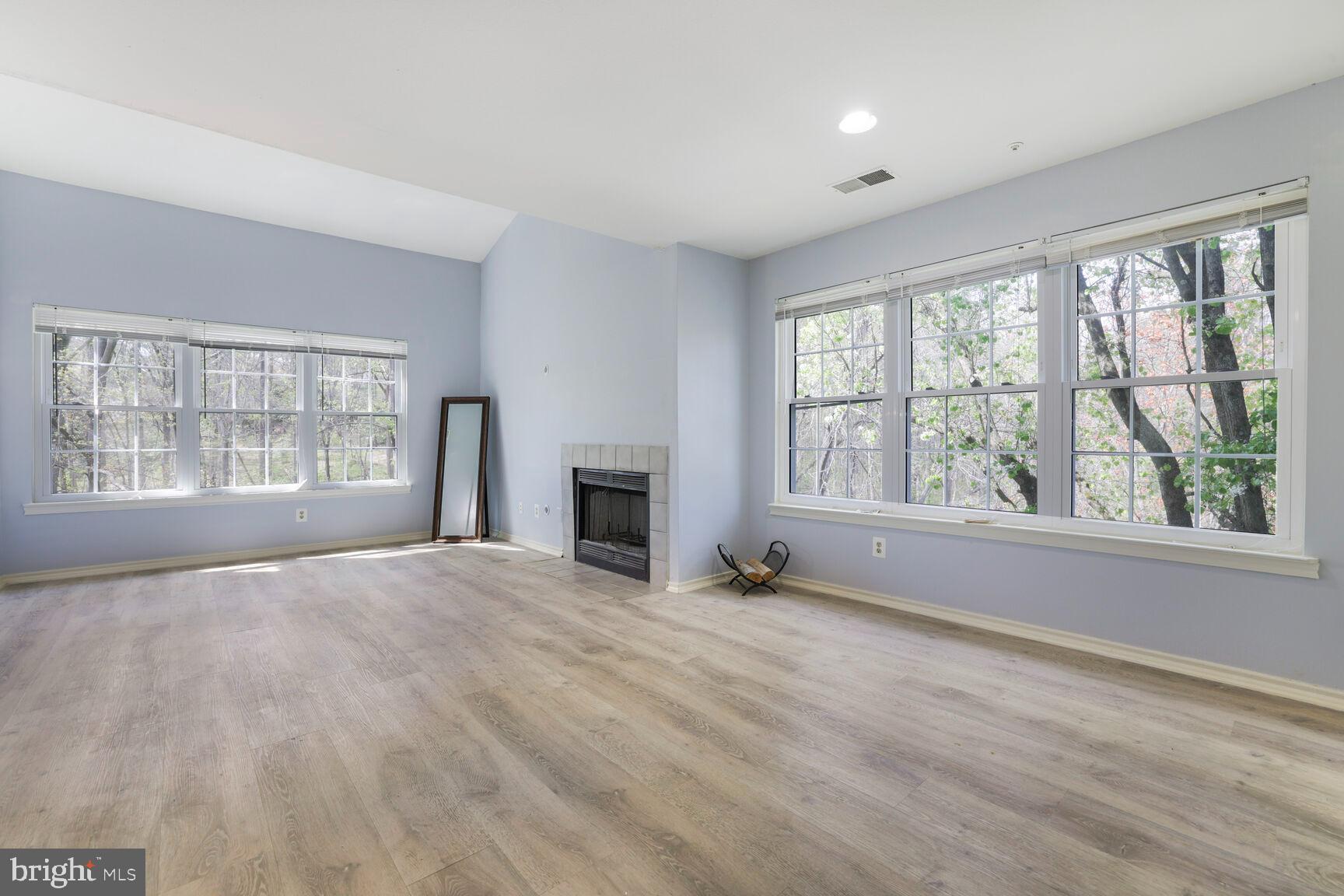 Spring into this move-in- ready, recently updated 2- bedroom, 2- bathroom condo--complete with dedicated parking and thoughtfully upgraded features throughout. A freshly renovated kitchen with contemporary quartz countertops, modern backsplash, brand- new cabinets and polished appliances for all the cooking essentials. New vinyl flooring flows seamlessly through the home, offering durability with a clean, contemporary feel. Enjoy cozy evenings with new fireplace panels, framed by sun- filled windows that bring warmth and light into your living spaces. Whether you're a first- time home buyer, downsizing, or investing, this home checks all the boxes: location, updates, style, and ease. Just bring your toothbrush-- it's ready when you are.