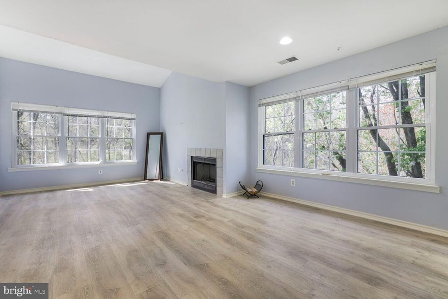 Spring into this move-in- ready, recently updated 2- bedroom, 2- bathroom condo--complete with dedicated parking and thoughtfully upgraded features throughout. A freshly renovated kitchen with contemporary quartz countertops, modern backsplash, brand- new cabinets and polished appliances for all the cooking essentials. New vinyl flooring flows seamlessly through the home, offering durability with a clean, contemporary feel. Enjoy cozy evenings with new fireplace panels, framed by sun- filled windows that bring warmth and light into your living spaces. Whether you're a first- time home buyer, downsizing, or investing, this home checks all the boxes: location, updates, style, and ease. Just bring your toothbrush-- it's ready when you are.