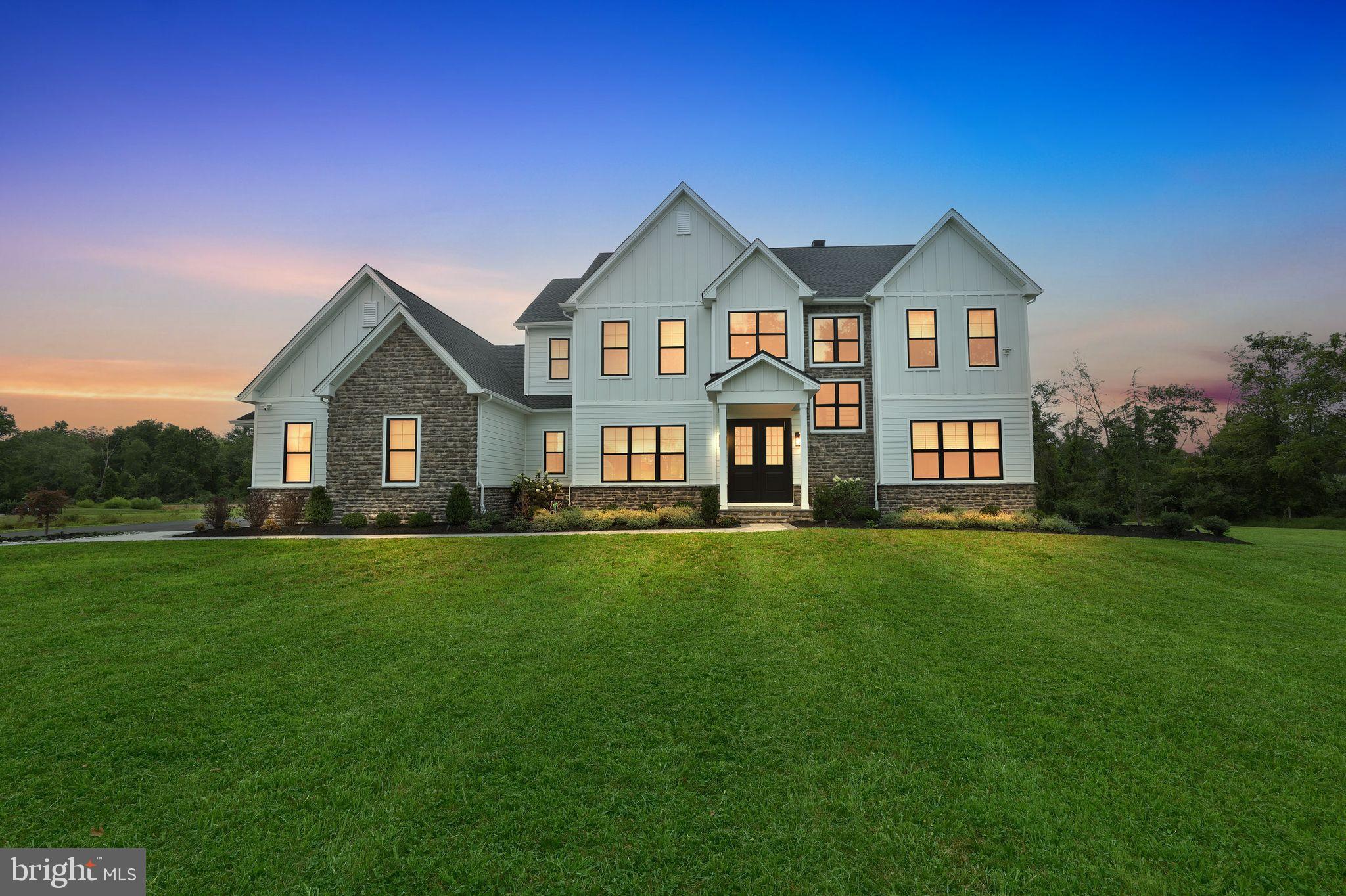 Welcome to 6934 Greene Meadow Lane, a stunning custom-built residence on over four acres in the heart of Bucks County, PA. Just one year old, this exceptional home offers over 4,000 square feet of luxury living space, blending modern design with timeless elegance.
Step inside to discover ten-foot ceilings, abundant natural light, and an open-concept floor plan that seamlessly connects each living space. The gourmet kitchen is a chef’s dream, featuring state-of-the-art Monogram appliances, custom cabinetry, and a spacious island perfect for entertaining. The walk-in pantry built just off the kitchen provides accessibility ideal for any chef.
The ground floor features a guest bedroom with full en suite bath, home office with stunning built in book shelves, and half bath.
The mudroom with floor-to-ceiling storage is located just off the garage entrance and is perfect for the busy household!
The primary bedroom is an ample retreat featuring a cozy sitting area, dual walk-in closets, and an expansive bathroom complete with walk-in shower and soaker tub.
The second floor area also accommodates three other bedrooms: one bedroom with en suite bath and two bedrooms with Jack and Jill bath. The laundry room is also located on the second floor, making laundry convenient and easy.
Retreat to the expansive finished basement, complete with a full wet bar, ideal for hosting any gathering or enjoying cozy evenings at home. Included in the basement is a large flex space room, ideal for a game room, home office, or whatever you need. Additional, unfinished storage space is located in the basement.
Outdoor living has been elevated with a professionally designed outdoor kitchen, including a built-in pizza oven, creating the perfect space for dining al fresco and entertaining year-round.
This home is appointed with three fireplaces and a whole house generator. These modern, elegant upgrades throughout—from designer fixtures and finishes to thoughtfully curated details that define true luxury - are truly exquisite and waiting for you.
Don’t miss your opportunity to own this remarkable property, combining contemporary style, comfort, and sophistication in one of New Hope’s most desirable neighborhoods.