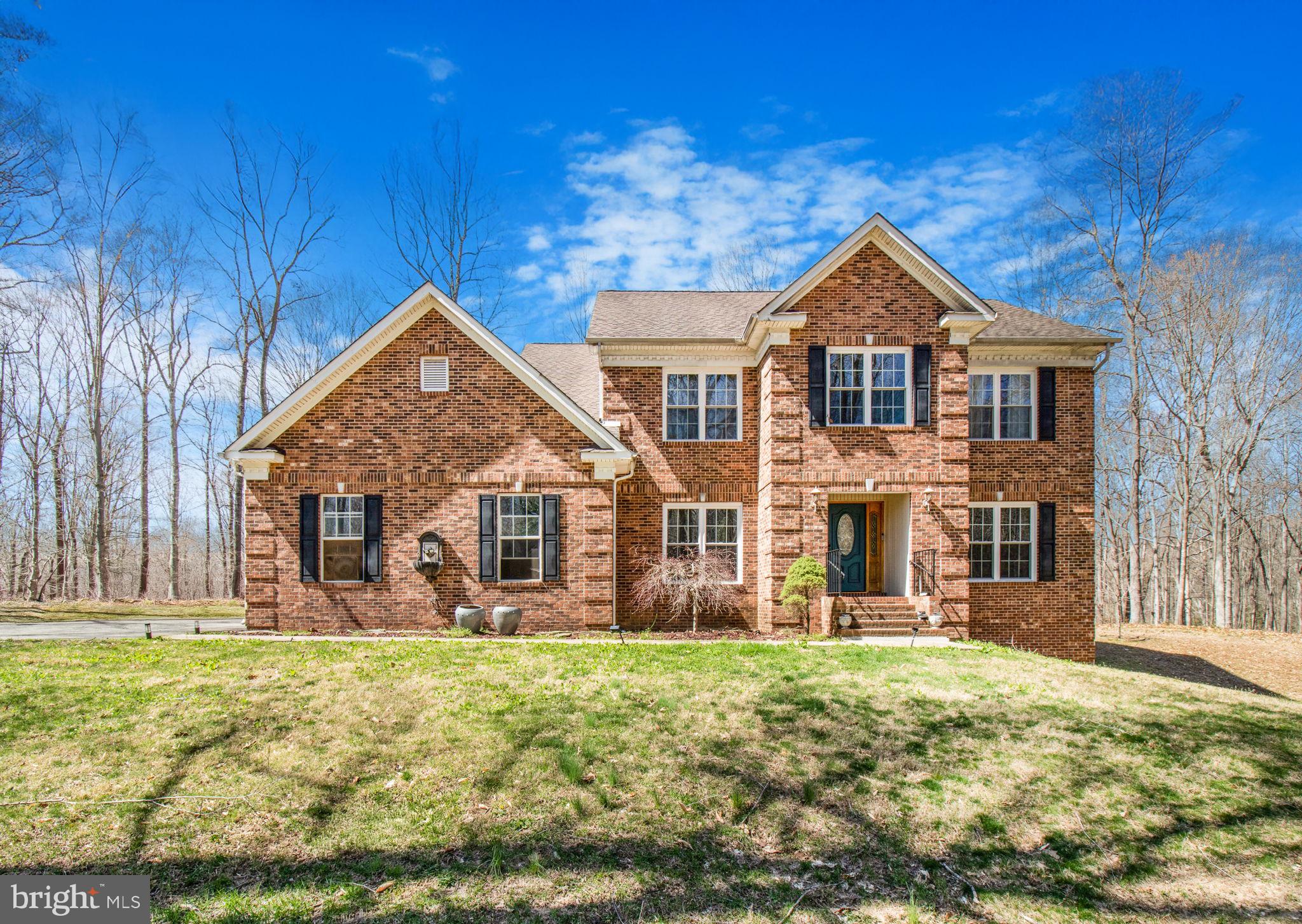 Mallards Pond Subdivision Waldorf, Maryland Charles County - Spacious 5 bedroom, 5 full bathroom Colonial with 2 car garage - scenic serene, private 3.2 private acres, 2,900+ square feet, Separate Living & Dining Rooms, Den/Office, Wood Floors, 2 story foyer, spacious kitchen that opens to a spacious family room with a fireplace, Eat in Kitchen with plenty of cabinetry, granite countertops, custom backsplash, a center island, double ovens and More! Upstairs boasts four roomy bedrooms, one of which displays an en-suite bathroom while the other two share a Jack n Jill bathroom
bathroom. The beautiful Owner’s Suite has a spacious walk-in closet, its own private bathroom with a large vanity and dual sinks, a tiled jacuzzi tub, and a separate shower. First floor full bathroom, Huge Walk-In Pantry & More!
The finished walk-out basement has a custom granite top bar, a spacious family room, an additional bedroom and a full bathroom. Enjoy or relax on the back patio that overlooks the private, tranquil backyard. No HOA! Show and sell!