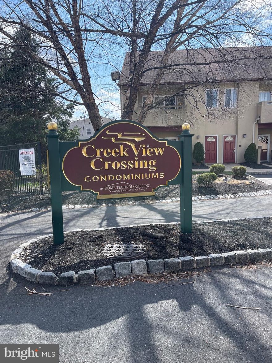 Exceptionally cared for and lovingly maintained by original owner first floor unit is so ready for a new chapter. Come over to appreciate convenient layout where spacious living room has designated dining area  right next to eat-in kitchen. Gleaming hardwood floors lead to perfectly sized primary bedroom with its own large bathroom and walk-in closet. The second bedroom is also roomy and seems even bigger thanks to mirrored closet doors. On a subject of closets : plenty and more! Coat closet right next to the entrance, walk-in pantry next to the kitchen, deep and wide hallway closet, generous linen closet, and laundry room conveniently fitted with shelves. Ceiling fans,  updated window shades, wide baseboards add comfort and style. Updated and regularly serviced mechanicals. Squeaky clean appliances. Designated parking spot right next to the door,  and plenty of visitor parking in this owners only community. Cozy patio to enjoy those long awaited warm evenings and a community pool for hot summer days. Make it yours!