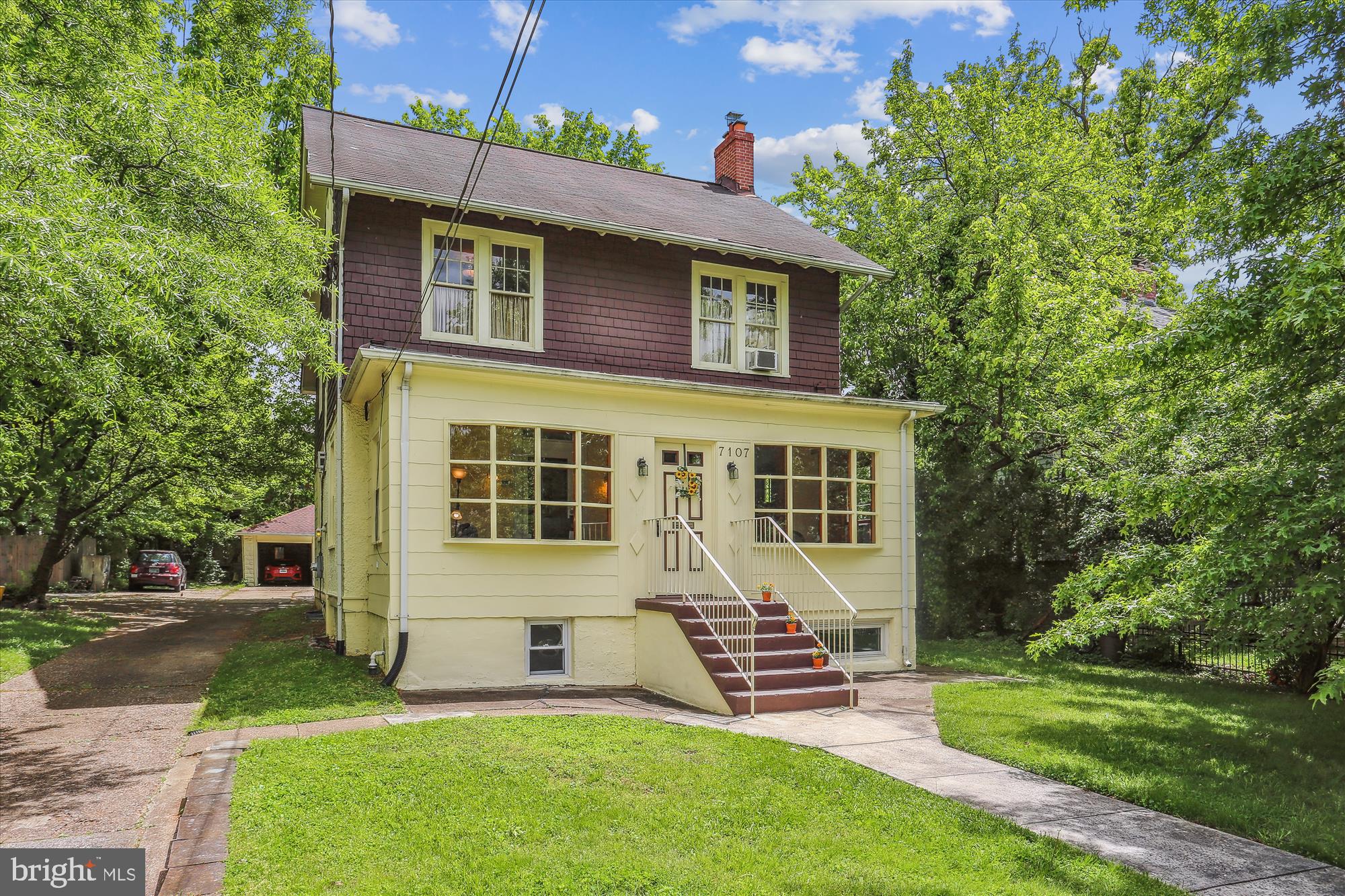 Price Improvement - $1,190,000! Open House - Sun 6/4, 1-3! Located in the heart of Takoma Park’s Historic District, this 1918 colonial style home is just steps away from the shops, restaurants and community happenings of downtown Takoma and a walk to the Metro! Original character of home remains captured in its high ceilings, restored hardwood floors and grand wooden staircase on the main level, pine floors on the upper level, wood ceiling on the 3rd, and in its many original windows and doors and even vintage mirror and crystal doorknobs. On main level, lengthy finished enclosed porch with bay windows streams sunlight into spacious living room with fireplace adjacent to separate dining room also with a fireplace as well as a custom-built wood and glass cabinet. The eat-in kitchen accommodates a long table, retains its customized 1960’s cabinetry, a full bath is located off a small extension of the kitchen, which is suitable for coats and shoes that opens onto back steps. Outside, copious private parking space ends in a 2-car garage, flanked on one side by the drive and on the other by lawn and a fenced-in garden area. Upper level of house has full bathroom off the hall and two bedrooms with original closets on one side. Two adjoining rooms on the other side have one walk-in and two original closets, and also share a finished extension that opens onto an outside porch and stairs, creating option to use space as separate bedrooms or as one master bedroom suite with private entrance. The large, airy, versatile room on level three has two deep walk-in closets, two side storage areas, built-in bookcase and shelving, and has been easily adapted for use as a bedroom, home office, yoga/exercise room, studio and more. Garden level can be accessed through main stairway or via its own side entrance. To one side of hall there is unfinished basement with laundry, utilities and storage, plus rough-in bathroom. Other side consists of a finished suite with one main and one secondary room, large full bath and kitchenette. Along with ample outside parking and private entrance, area can serve multiple purposes, including as semi-autonomous in-law suite or professional suite for private business (permissable under Carroll Avenue zoning regulations.) A truly special home located in the sought-after section of historic Takoma Park!