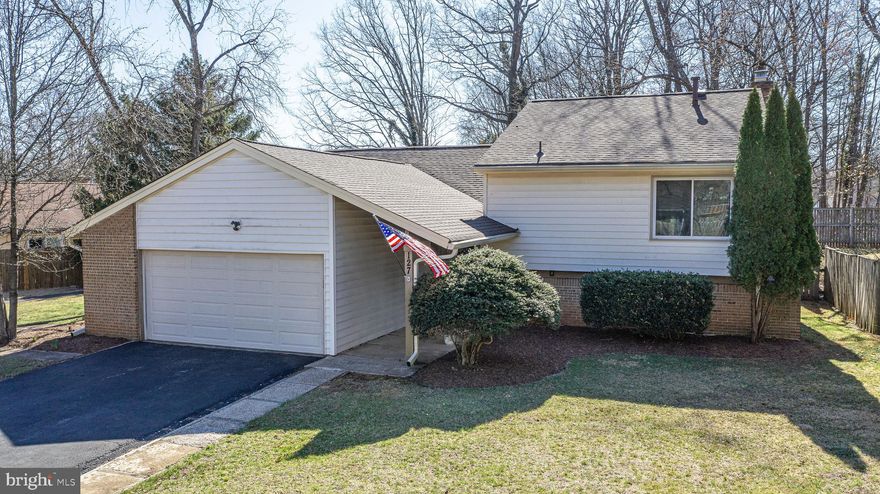 Immaculate - EXPANDED  open and bright Redondo model in popular Sugarland Run!   Over 2100 finished square feet! BACKS TO PARKLAND AND TRAILS. 4 bedrooms 2.5 bath home.  Large open updated kitchen features white Shaker cabinets, granite countertops and stainless appliances.  Coffee bar/small appliance bar with pretty butcher block countertops.  Large morning room looks out to landscaped back yard the wooded parkland!  New LVP flooring on main level.   Cathedral ceilings.  Refreshed baths. Four seasons sunroom/bonus room for extra flex space.  Lower level features large family room with wood burning  fireplace, fourth bedroom and bath.  FENCED YARD AND LARGE DECK. Two car garage with 30 amp outlet and extra door added for access directly into home. *ROOF 2023*.  NEW GUTTERS AND GUTTER GUARDS. HOTWATER HEATER 2023.  HOA amenities include pool membership, tot lots, tennis and basketball courts.