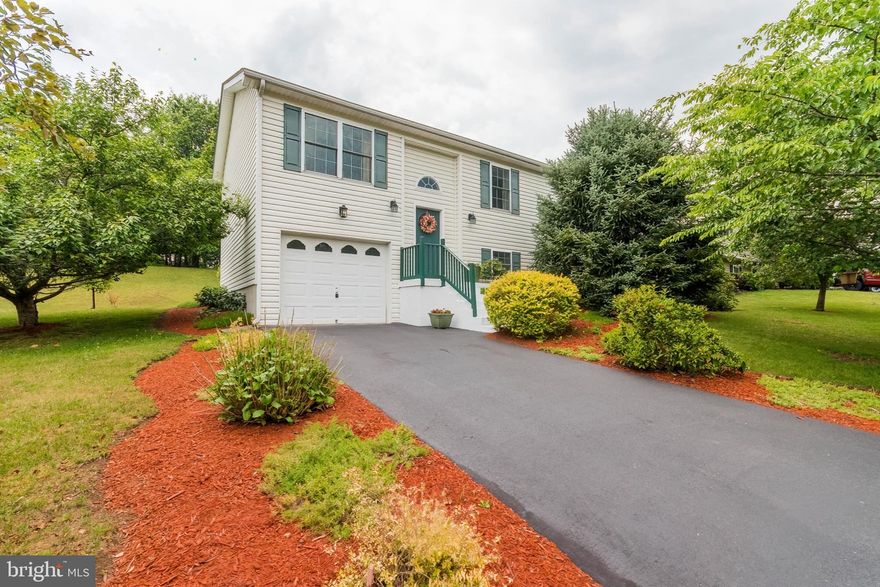 Don’t miss this opportunity! Immaculately maintained, move- in  ready home. Welcome home to this adorable split foyer home that has had only one owner in it's life of 21 years! 
When you walk into the home you immediately feel how clean and bright everything is. The entire property has been loved and cared for diligently and meticulously. It has a new roof, new HVAC, and newer hot water heater. This place is PERFECT!! 
The landscaping in the yard is beautiful and it feels like a little oasis! Upstairs there is an open and bright living/dining area, a large kitchen, 3 bedrooms, and 1 full bath. Downstairs there is a full bath, a large rec room with a pellet stove, a large laundry/utility room, and a 1 car garage with a terrific storage area/crawlspace that runs along the front of the home (underground). 
The back yard is the best of both worlds. It is pretty and landscaped, with a flat open area around the house that then inclines to a plateau with more flat open space for playing, sitting, reading, gardening, etc., and there is plenty of space to give it your own flavor and style.
The neighborhood is terrific for walking, riding bikes, running, skateboarding, basketball, you name it! With it's wide, sweeping streets, and no thru-traffic, you feel that you are in a park-like setting. The entrance has a large open area and traffic circle that sets the tone for this great little hidden gem of a neighborhood. Plus, there is even less road traffic at the end of All American Way where this property is located, making it feels even more quiet and peaceful. 
Located near the Air National Guard Base, shopping , I-81, restaurants, and all that the Eastern Panhandle of West Virginia has to offer!