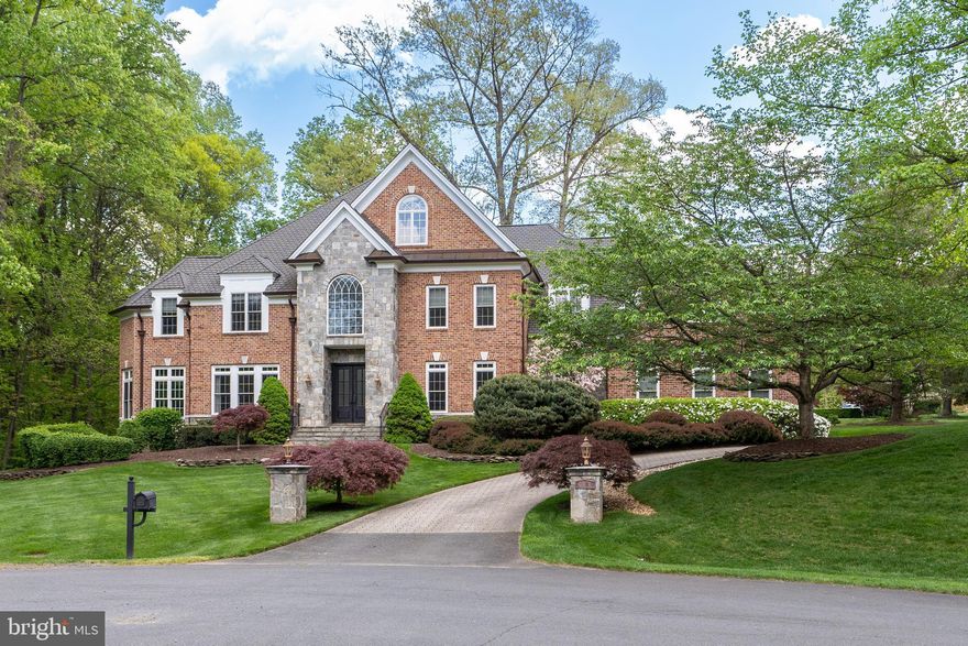 Welcome to an exquisite Oakton Estate, a timeless masterpiece nestled on a rare .85-acre private cul-de-sac lot. Boasting unparalleled craftsmanship and attention to detail, this custom-built home by master builder George B. Sagatov spans 9,750 square feet of livable space across three levels, offering a luxurious retreat for discerning homeowners.

Upon entering through the custom steel front doors, you are greeted by an elegant marble foyer flanked by dual staircases in the rear, setting the tone for the grandeur that awaits within. The main level, adorned with 5-inch walnut floors, features a beautifully renovated chef’s kitchen and mudroom, exuding both charm and functionality. The gourmet kitchen is a culinary enthusiast's dream, equipped with a massive 12-foot custom wooden island, marble countertops, professional-grade appliances including a Viking range, additional Viking wall oven, Viking Refrigerator, built-in microwave, two wine refrigerators, two dishwashers, farmhouse sink, and a built-in Miele coffee station. A spacious pantry seamlessly connects to the fabulous mudroom, ensuring effortless organization and storage.

Entertainment abounds on the main level, with a two-story family room boasting a striking stone fireplace and an abundance of natural light filtering through an expansive two-story wall of windows. Adjacent to the foyer, a light-filled dining room, living room, and sunroom provide versatile spaces for large gatherings and relaxed lounging. For the utmost convenience, an office adorned with a wall of built-in shelving offers a serene workspace.

 The upper level is a haven of comfort, featuring a renovated primary suite adorned with a gas-burning fireplace, sitting room, and a lavish designer bathroom complete with dual sinks, a soaking tub, and a glass-enclosed shower. The custom closet is a showstopper. Three additional ensuite bedrooms offer plush accommodations for family and guests, while a conveniently located laundry room enhances practicality.

Descending to the lower level, entertainment options abound with a wood-burning stone fireplace, family room, billiards room, theater room, recreation room, and a well-appointed bar. Wine enthusiasts will delight in the wine cellar, while fitness enthusiasts will appreciate the gym and sauna. An additional light-filled bedroom for guests or au-pair. Also, a utility storage room provides ample space for organization and functionality.

 Outdoor living is equally enchanting, with an outdoor stone fireplace and patio offering an idyllic setting for al fresco gatherings amidst lush greenery. The heated 3-car garage with brand new doors ensures comfort and convenience year-round.

 Situated in a private and tranquil setting, yet just minutes from Rt. 123 & I-66, this exceptional residence epitomizes luxury living at its finest. Whether hosting grand soirées or enjoying quiet moments of reprieve, this Oakton Estate offers a lifestyle of unparalleled sophistication and comfort.