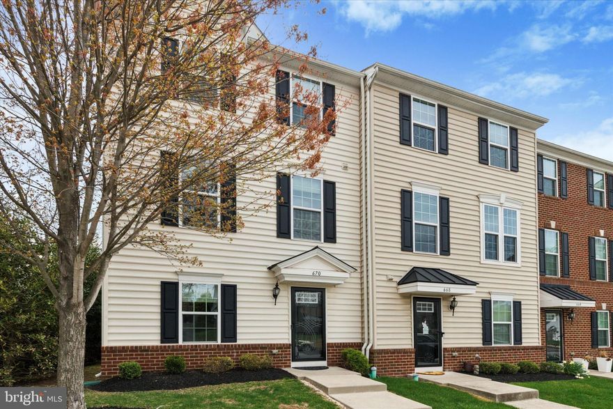 PRICE REDUCTION ! Bring your buyers to this beautifully maintained 3-bedroom, 2 full and 2 half-bath home offers the perfect blend of comfort, elegance, and convenience. From the moment you step inside, you’ll notice the rich hardwood floors, crown molding, and neutral color palette that flow effortlessly throughout the main living areas.  The first floor features a versatile living space—perfect for a home office, playroom, or lounge area—along with a hall closet and a convenient powder room.  Upstairs, the second level is made for entertaining, with a spacious family room adorned with crown molding and recessed lighting, and a beautifully appointed kitchen that truly impresses. Enjoy extended cabinetry, gleaming granite countertops, stainless steel appliances, a large center island with seating for four, and a stylish beverage bar with glass-front cabinets. A cozy dining area opens through French doors to a private deck with privacy walls—your new favorite spot for morning coffee or evening relaxation.  The third level hosts the serene primary suite, complete with a tray ceiling, ceiling fan, walk-in closet, and luxurious en-suite bath featuring dual granite vanities, a soaking tub, and a tiled glass-enclosed shower with built-in seat. Two additional bedrooms, each with ceiling fans, share a well-appointed hall bath, and a walk-in laundry room adds convenience to your daily routine.  Additional highlights include an abundance of natural sunlight, generous storage space, and an attached 2-car garage. Ideally located just minutes from Routes 309 and 113 and within walking distance to local shopping and dining—this move-in ready home has it all.  Don’t miss your chance to make this stunning townhome yours—schedule your tour today!