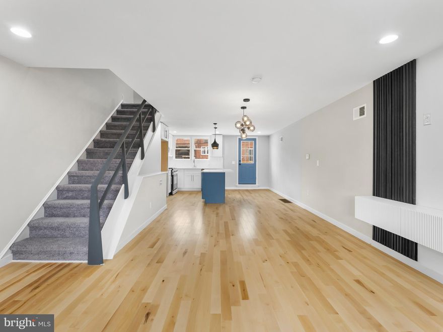 Welcome Home to 1115 E. Hortter St. Discover this beautifully renovated 3-bedroom, 2-bath townhome located in the vibrant East Mount Airy neighborhood. Enjoy the convenience of nearby restaurants, shops, and easy access to trains and bike trails. Step inside to be greeted by stunning natural oak hardwood floors that flow seamlessly into your modern, contemporary kitchen. The kitchen features sleek white soft-close shaker cabinets, a stylish backsplash, and beautiful quartz countertops. A spacious center island offers ample workspace and seating. Relax and unwind on your newly constructed rear deck, providing a private outdoor retreat. Upstairs, you'll find three generously sized bedrooms and a modern hall bath. The finished basement and additional full bath offer extra living space and convenience. This home also includes off-street parking and a private driveway. Don't miss the opportunity to make 1115 E. Hortter St. your new home. Schedule your tour today! Owner is motivated!!!