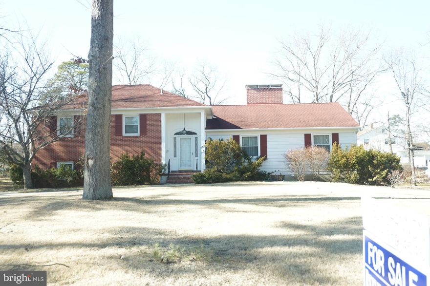 Spacious multi- level home situated on a quiet tree shaded street within walking distance to many downtown conveniences.  Less than a mile to Route 55 off on ramps,  midway between Atlantic City and Philadelphia ( approx 40 minutes) Enter through  large foyer with 2 double closets, dramatic vaulted ceiling in generous size  living room with floor to ceiling fireplace,  wraps around to dining area .  Lots of windows allows plenty of natural light.  Eat in kitchen is all white,  brick wall from fireplace in living room,  pantry closet features pull out shelves, tile flooring.  Off the kitchen is laundry closet and powder room. upper lever has 3 bedrooms, jack and jill bathroom from main bedroom and hall way.  Main bedroom has full wall of closet with built in drawers.  Remaining bedrooms also offer closets with builtins and all closets have lights.  Den is on lower level along with 2nd full bath.  Another few steps down takes you to basement level which is fully finished with carpet and paneled walls and 2nd fireplace.  Lower level and basement lever have full size windows and are at ground level .   2 car garage is entered from rear of house and has 2 electric garage door openers.  Den and basement enter garage.  Roof is 8-10 years old,  heat/air is multi zoned and furnace was new in Jan. 2024.  Basement is heated with electric baseboard heat.  Fireplaces were never used.. Square footage does not include family room and bath on lower level and finished basement level.  Both levels have full windows.