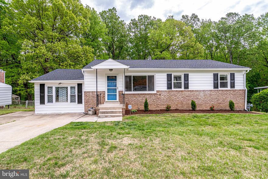 Welcome home to 9004 Anna Drive!  Enjoy a newly updated 4 bedroom 3 full bath home with large, fenced yard backing to woods with many of your neighbors living there for decades.  Kitchen features updated countertops, new stainless appliances.  Bathrooms with new vanities, tilework, and dual-flush toilets.  New ceiling fans and carpet throughout and recessed lighting.  Large rec room just off the dining area.  Full basement features a bedroom/bonus room with en suite full bath.  Newer washer/dryer and rough in for wash tub and walk out to concrete  patio from the laundry room.  Great commuter location, close to Branch Ave and 495.  Video tour coming soon!