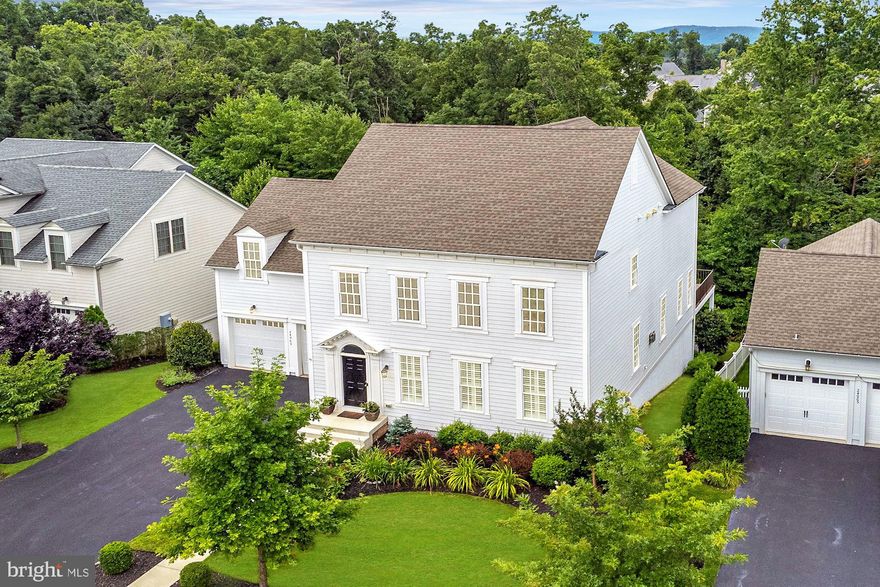 Incredible home and the best value in Willowsford, boasting nearly 5,000 sq.ft. on three finished levels, all on a premium lot, backing to conservation space! NEWLY REMODELED KITCHEN  AND SELLER ALSO OFFERING $20,000 CREDIT TO BUY-DOWN YOUR MORTGAGE RATE!! A great opportunity to live in Northern Virginia's premier neighborhood AND reduce your monthly payment! 
<br><br>
This Bayley model by Integrity Homes features an open and airy floorplan with upgrades galore. Fully appointed kitchen with large sleek island, modern pendant lighting, high-end stainless-steel appliances, and upgraded cabinetry.  The main level also features hardwood floors throughout, huge family room with gas fireplace, formal living and dining rooms, walk-in pantry, mudroom with custom built-ins, and access to a large maintenance-free deck.
<br><br>
Upstairs you'll find a light-filled owner's suite with walk-in closet and upgraded luxury bath.  Three spacious bedrooms, a large secondary bathroom, and a conveniently located upper-level laundry complete this level.  The fully finished basement includes a media area with surround sound, custom wet bar with wine fridge and dishwasher, game room, spacious guest suite and walk-out to the rear patio, making this an entertainers dream.  Outdoor living at its finest includes the huge deck with stairs down to the patio, hot tub, all backing to mature trees for privacy and shade.
<br><br>
Centrally located near all that Willowsford has to offer! This award-winning community provides over 50 miles of walking/biking trails, 2000 acres of open space, a state-of-the-art fitness center, multiple pools and splash pads, numerous lakes and ponds, a zipline park and archery range, tree houses, multiple tot lots, a community garden, a farmstand and CSA, a teaching and demonstration kitchen, and much more!!  Sought after Loudoun County Schools, quick access to commuter routes, shopping, and all your daily needs. This one has it all!