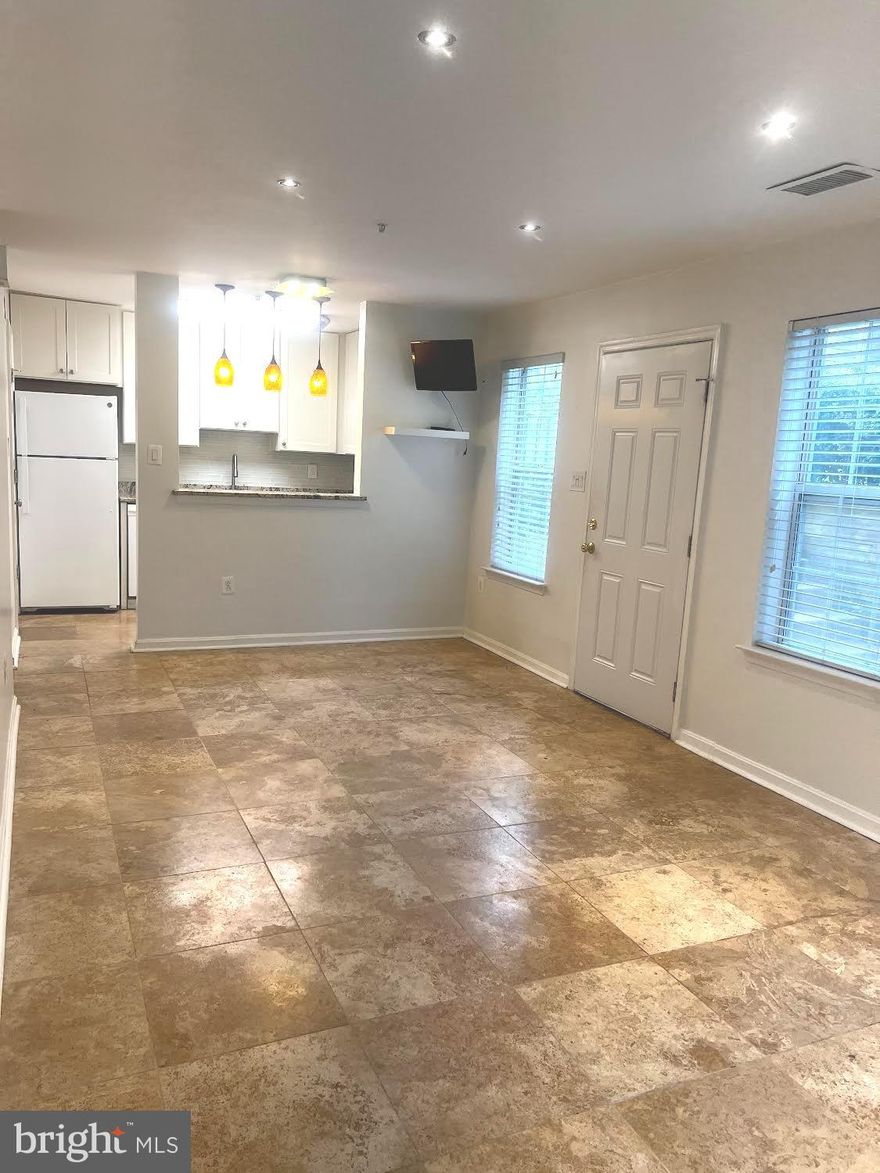 Location, location, location. Do not miss this opportunity to live in this sought after Quince Haven Community that is close to everything! Minutes to school, shopping, highway, etc. Recent updated kitchen in with white cabinetry and granite counter top, bathroom  with custom tile work, vanity, and fixtures. Unit is on the first floor with walk-out sliding door to green space and running/jogging trail. Reserved parking #13 plus unassigned (no number) parking spaces. Must see before it is gone!