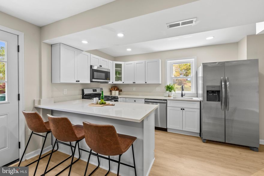 Welcome home to 4008-1 Frankford Ave! This turn-key home boasts an array of sleek finishes, featuring 4 bedrooms and 3.5 bathrooms. Step inside, and you'll be greeted an open floor, recessed lighting, new LVP flooring and fresh paint.  The beautifully updated modern kitchen with stainless steel appliances is truly the heart of this home, featuring quartz counters, tile backsplash and a large island perfect for entertaining guests. All bathrooms have been updated with beautiful high-end finishes. Just upstairs you will find 3 bedrooms and 2 bathrooms. The fully finished lower level offers a large family room that can be used as a home office, gym, or extra space for guests and 1 additional bedroom and a full bath. Outside you have a fenced backyard, deck and driveway. Convenient commuter routes to 695 & 95.