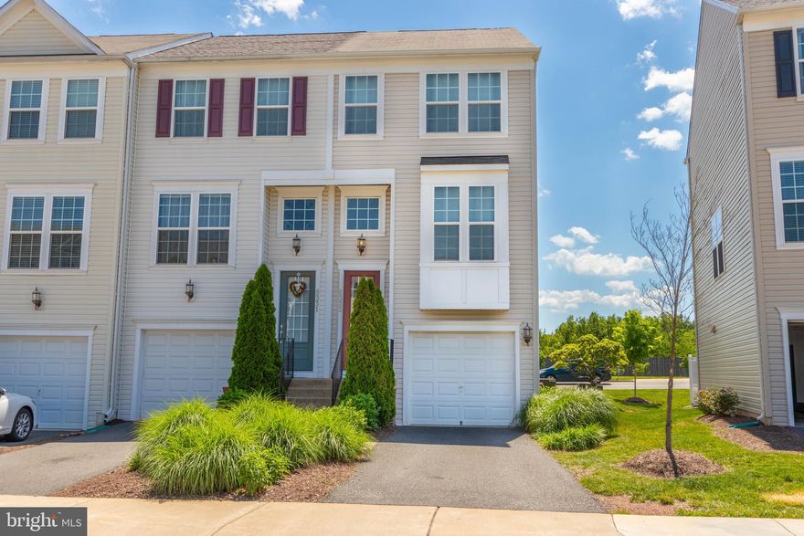 Back on the market, buyer financing fell through!!! Built in 2013 with the full upgrade package in Heritage Crossing community in Manassas. End unit, three level Townhouse style Condo with 1 car garage, and large deck. The middle floor's open floor plan features dark hardwoods throughout the large gourmet kitchen with Stainless Steel appliances, Granite counters, 9'+ ceilings, dining room, and living room. Upper level features a master suite with walk-in closet and bathroom. Additional bedroom and full bath upstairs. Lower level has a bonus room/3rd bedroom with adjoining full bath.
Located off of Sudley Road, you're close to all major commuter routes, shopping. Prince William Medical Center, restaurants, Old Town Manassas and the VRE!  Community amenities include large outdoor pool, clubhouse, tennis courts and playground.  It even has driveway and garage parking!  Schedule your showing now, because this one won't last!