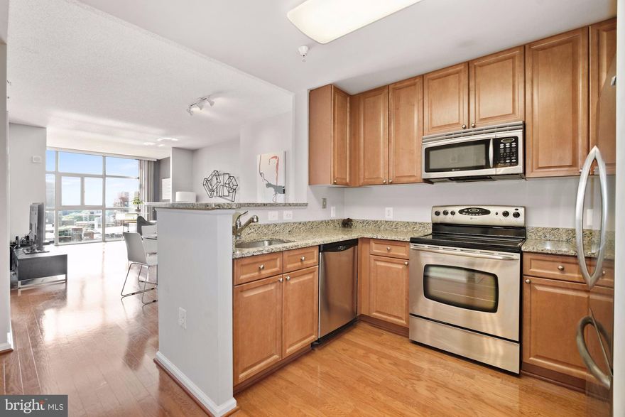 Fabulous 1 bedroom/1 bath condo in sought after Sterling Condos in North Bethesda. The unit is flooded with natural light from the floor to ceiling windows and offers great surrounding city views.  Gleaming wood floors and open floor plan.  The kitchen boasts stainless steel appliances and granite countertops.  In-unit W/D.   Assigned garage parking conveys! Great location in Bethesda!  Walking distance to two grocery stores (Harris Teeter and Giant), White Flint Metro station, across the street from the award-winning Pike & Rose full of shopping and dining!   Building features 24-hour concierge coverage, a fully equipped fitness facility, spacious club room, enclosed courtyard complete with patio and grill, and an outdoor swimming pool. http://spws.homevisit.com/mls/296898 for the walkthrough video.