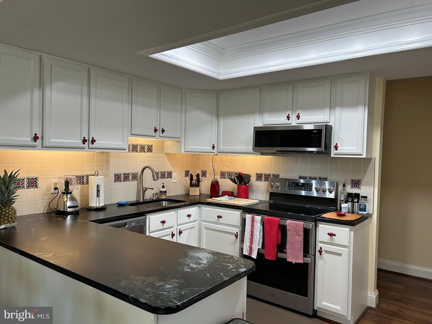 Sellers have moved out and Montgomery Mutual has completed their inspection.  The unit is now empty.  So many updates, you won't have to change ANYTHING!  From the building front entrance, the unit is 6 stairs down.  The enclosed sunroom in the back is on the ground level.  Once inside you will appreciate the many improvements made by the current owner.  There is a built-in wall unit in the living room, new appliances, back splash and counters in the kitchen, new vanity and tub/shower in the bathroom. Luxury vinyl plank flooring and fresh paint throughout.  Washer and dryer in the unit. Enjoy the numerous amenities that Leisure World has to offer. Buyer MUST have at least a 700 credit score.  Buyer agrees to pay 3%  of gross price  to Leisure World of Maryland plus $500 to the resale improvement fund.