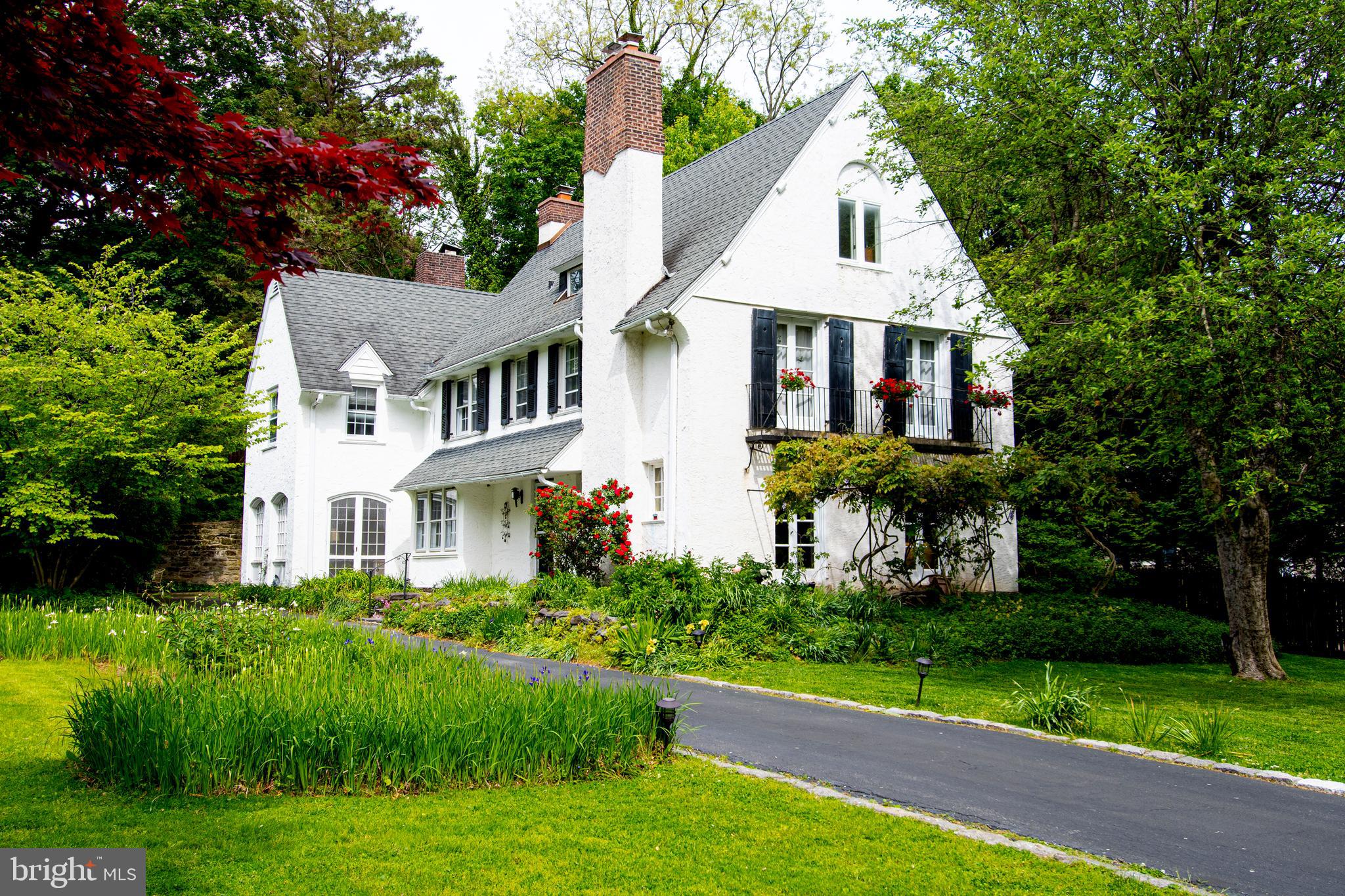 Welcome home to 130 Llanfair Road in North Ardmore. Beautiful, gracious 5-6 bedroom home in one of the Main Line's most coveted neighborhoods. Walk to everything. Over-sized level lot. Steps from Suburban Square with Trader Joes, the Ardmore Farmers Market, Lifetime Fitness and the Apple Store. A six-minute walk to the Ardmore train station with both SEPTA and Amtrak service. Award winning Lower Merion Schools and this location gives you a CHOICE of two of the finest high schools in the nation: Harriton HS or Lower Merion HS, which is a block and a half away. This house has been lovingly maintained. Center hall design with excellent floor plan and flow. Spacious and sunlit. Ample storage throughout. To the right from the entry hall, the living room features a gas fireplace, French doors to a beautiful wisteria framed patio, and built-in bookcases. To the left is the sun-drenched dining room which connects to the kitchen and family room. The kitchen has a lovely bay window eating area, good storage and an adjacent laundry room. The family room features gorgeous rounded windows and doors, a second fireplace and built-in bookcases. A powder room is conveniently accessed from the family room. The second floor features the spacious master bedroom with an ensuite bathroom and French doors to the Juliette balcony. There are three additional large bedrooms on the second floor, along with two additional hall bathrooms. The third floor features a fifth bedroom and another hall bathroom, along with a bonus room currently being used for storage. There is also a third-floor attic with lots of additional storage. The unfinished basement is clean and dry with painted concrete floors and room for exercise, hobbies and play. Beautifully landscaped with mature plantings and a big level yard for outdoor fun. Singing Woods Preserve across the street is a neighborhood treasure providing tranquil wooded views and the sounds of songbirds and other wildlife. The house is set back from the street, quiet even though it is so close to all the conveniences of Ardmore. Exceptional walkability encourages chats with neighbors whether walking dogs, strolling with kids, or walking to the train. What makes this neighborhood so special, so connected are wonderful events like the annual North Ardmore garden party, potlucks, block parties, and a holiday sing-along.