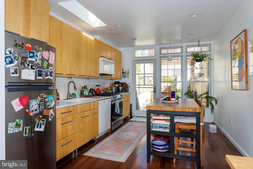 Located in one of the hottest neighborhoods in the city, this rental property at 2nd and Girard straddles the Old Kensington, Fishtown and Northern Liberties neighborhoods. It is on a tree-lined street and has three bedrooms and two full baths. The home has high- ceilings, recessed lighting, hardwood floors, and a dry basement for storage. The first floor has a large open-floor plan that includes a living room, dining area, kitchen, and a wall of windows to the back patio. The kitchen has a full-sized washer & dryer, quartz countertops, stainless steel & white enamel appliances, and a wall of cabinets. It is wide enough to accommodate either a kitchen island or breakfast nook. There is a large patio and brick-lined yard with a fire pit. The second floor has two bedrooms and a full bathroom with a tub shower. There is a roof deck off the rear second-floor bedroom that overlooks the backyard. The top floor has a soaring ceiling with a large open bedroom, ceiling fan and full bathroom. The Septa stop, Acme grocery store, Starbucks and liquor store are all one block away and there are dozens of popular restaurants, shops, and pubs within a few blocks. There are many day care and gym options nearby. The closest dog park is 1.5 blocks up the street.