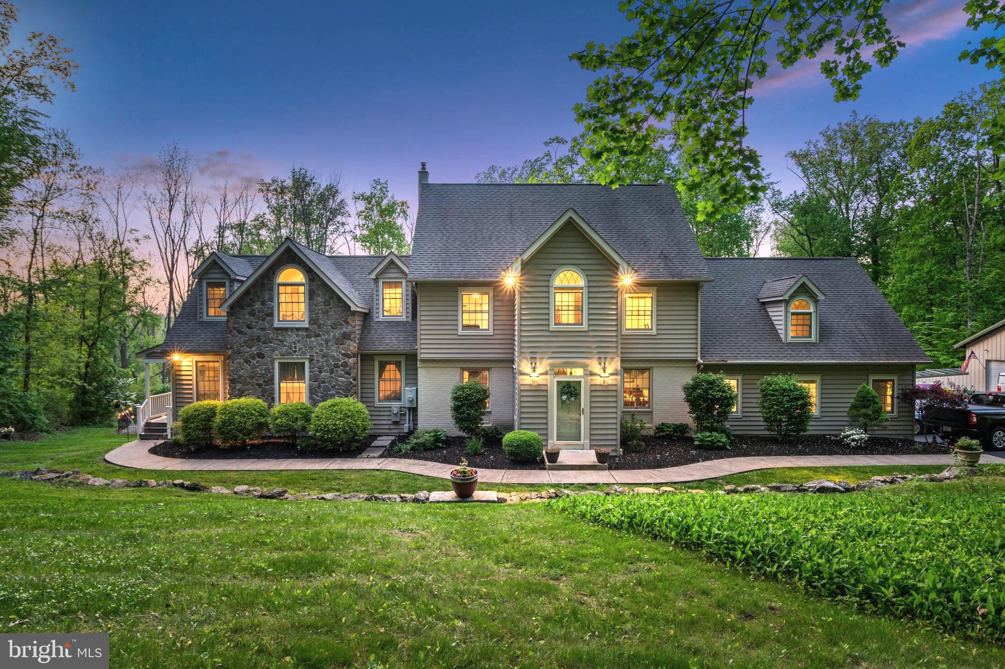 HUGE PRICE REDUCTION! This lovingly expanded colonial is located just minutes from New Hope Boro and Peddlers Village. The original 1960's footprint has been completely transformed in 2006 into a 6500sqft property with infinite multi-generational family opportunities! Â
We are excited to present this beautiful home to buyers looking for the perfect living space for in-laws, large families and more.
With 2 completely private living spaces each with their own private entryway, it has provided the current owners the perfect home to raise their children, while their elderly parents enjoyed the spacious two story In-law suite.
The main home, approximately 5500sqft, has a first-floor separate suite with new hardwood flooring is perfect for a master suite, nanny quarters, private office or gym space or a private wing for visiting guests. The 2nd floor offers the current Master En-Suite and 3 additional bedrooms, with a recently renovated 2nd floor hallway bathroom. Â
The main home includes an open floorplan for the Kitchen and Great Room. The huge 30x25 great room, a natural family favorite spot with inset wood stove, crown molding, new hardwood flooring, and enormous Anderson windows providing plenty of natural sunlight. Â
The open floor plan kitchen includes a stainless appliance package, 3 large pantry closets, and Italian tile backsplash, honed black granite counters on all sufaces, including the huge center island. Island counter seating for 4, loads of prep space and plenty of storage, makes meal prep and family time seamless. The formal living room has beautiful floor-to-ceiling custom built bookshelves, crown molding and recessed lighting. The formal dining room has wainscoting, crown molding and large windows. Additional rear access leads into the rear mudroom complete with large laundry room, and storage space.
The lower level of the home has been converted into a fun bar room and game room area. Entertain friends in the walk-out basement area with a custom-built oak bar, kegerator, and ½ bath complete with mancave urinal.
The Separate In-Law space is a two-story residence with walkway to private front door entrance, has a full bath on each level and cathedral ceilings on the second floor. Living, dining and kitchen on main floor, Master bedroom and bath on the 2nd floor. If the buyer wishes, the In-Law space can be opened up to the main home thru the living room and upstairs bedroom walls.
This large home is nestled on an expansive and private 3 acres of property which is a haven for deer and native birds.
All ages will love the large saltwater Carlton plaster pool with diving board. Grill and enjoy dinners from the elevated Trex deck overlooking the pool and resident hummingbirds. At night soak in the 6-person hot tub or roast marshmallows around the huge backyard fire pit.Â
Â
The enormous 40x60 metal pole building with heated workshop and parking for 8 cars is a collector and carpenters dream!Â
The current owners added an 18kW solar system to the workshop building in 2018 which provides 80-90% of your total electricity needs.Â
aThe house is served by a large septic system with sand mound.Â
 Watch the New Hope-Ivyland steam train chug by your back yard from the great room next to your warm wood stove while snow falls. Set in the desirable New Hope-Solebury school district ranked top 25 in the state and 357 in the nation you are only 7 minutes from the Middle/High School and just 12 minutes to the Elementary school. Enjoy all the culture the area has to offer with funky shops and exceptional restaurants of New Hope and Lambertville just down the road or in nearby Doylestown Borough. Easily commute to NYC with the Hamilton or Trenton strain stations both 25 minutes away or Philadelphia airport just a 50 minute drive. Come settle your whole family into Chives Den, make it your own, and see what the quiet fuss of Solebury is all about!