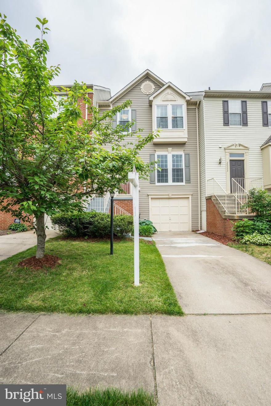 Stunning townhouse in Cascades w/many upgrades! Beautiful hardwood floors entire main level/stairs, completely remodeled powder/master bath, New Roof 2012, New Windows 2013, New Water Heater 2013, Fresh Paint, Elegant Columns, Vaulted Master Suite, Oversized Secondary Bedrooms, Spacious Rec Room with Fireplace, Great Double Deck and much more!