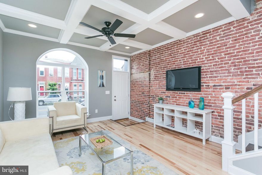 Another immaculate Charm City Builders COMPLETE renovation project w. 2-car parking + Deck! This 3BR/3.5BA + Den is loaded with detail: custom tile, tray master ceiling, coffered LR, exposed brick, and MUCH more. New kitchen incl granite countertops and ss appliances. Light maple hardwood and half ba at main lvl for easy entertaining. Waterproofed/finished basement. Few blks from Patterson Park!