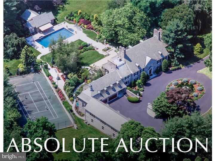 ABSOLUTE AUCTION! Starting bid $2 million! Previously listed for over $6 million, this property owned by well known celebrity Pat Croce, will be sold to the highest bidder on auction day, October 25th, regardless of price! Opportunities to own such a dream property on the Main Line come along very rarely. This is your time to take advantage of this incredible buying opportunity! As you enter this gorgeous luxurious and timeless stone colonial mansion you are drawn to the beautifully inlaid marble floors and the dramatic dual butterfly staircase that lead you to the upper levels. The home features 5 fireplaces, recently remodeled large master suite with separate his and her baths. The large inviting chef's dream kitchen, incredibly landscaped grounds with regulation tennis court, beautiful pool with detached pool house make this home perfect for entertaining or just enjoying quiet weekends on the sprawling country Estate.