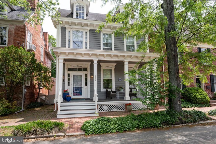 The Vannort House stands proudly on historic Queen Street with a colonial-era smokehouse in the yard!  Light & breezy: The 31' long screened-in side-porch has doors from the eat-in Kitchen, formal Dining Room, and the grand high-ceilinged Living Room! Keep all the doors open into the screened porch  for an amazing indoor-outdoor way of living! A truly versatile layout for entertaining and relaxation.  From the front formal entry, an elegant curved-rail staircase acsends to the second & third floors with large light filled landings. Spread out in generously sized rooms throughout this home.  The formal living room has almost 10 ft ceilings,  beautiful crown moldings, a wood burning fireplace and 3 doors to the Foyer, the Dining Room, and the screened porch. The formal dining Room also has beautiful woodwork, built-ins, a non-working wood fireplace, and 4 doors to the front hall, kitchen, Living Room, and Screened porch. A first floor laundry closet and bath are in the cozy rear family room. There are four bedrooms on the second floor all with hall doors and some also with interior connecting doors. If you don't need 4 bedrooms, make one into a generous walk-in closet, a new luxury bath or a playroom! Also on the second floor, there's a large primary bedroom in front, just off the 8'x8' landing, a back hall with the other 3 bedrooms, a full hall bath, a fun rear staircase to the kitchen and another to rear attic storage. In the front, the grand stair leads to a third floor landing and an unfinished attic room with windows that could be finished off as an office or a fifth bedroom. The two-room partial basement with newly parged brick and stone walls could house your new wine cellar! The Vannort house, named for William Vannort who built #107 and also designed #101 is an example of Victorian classicism and an important part of the eclectic streetscape that makes N Queen Street one of the most desirable residential locations in town. This comfortable home has been lovingly maintained by the current owner since 1983.  You may find this charmer could benefit from a few updates so it is priced accordingly to allow for plenty of new equity on this lovely block. It's just steps away from the Saturday Farmer's Market, restaurants, bakeries, shops, parks, and the serene Chester River. All measurements are estimated. Showings start Thursday May 15.  Owner occupied. Please respect privacy. Showings strictly by appointment only.