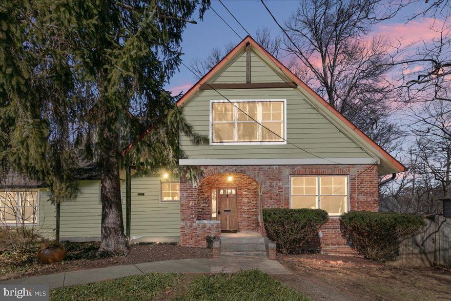 816 Colby Avenue isn’t just a house—it’s a story, a sanctuary, and a forever home in the truest sense. Thoughtfully renovated and expanded, this one-of-a-kind five-bedroom, three-bath home was designed for connection—between spaces, between indoors and out, and between past and present. Set on a double lot in a close-knit enclave of Takoma Park, this home embodies warmth, artistry, and a deep sense of place. The heart of this home is the breathtaking living area which includes the kitchen, great room, and dining room. The chef-worthy kitchen offers ample prep space, wood floors, and an effortless flow into the sun-drenched dining room, where vaulted ceilings and skylights create the perfect backdrop for slow weekend breakfasts or lively dinner parties. Step into the living room, where terracotta tiles, soaring ceilings, a Spanish Revival-style fireplace, and stone and wood columns set the tone for the home’s artisanal charm. The design of the space draws inspiration from the warmth and texture of a Guatemalan hacienda and is informed by the ideas of Sarah Susanka and other thought leaders who value flow of space over size. Working with renowned local architects Maria Wright and Dana Haden, the owners were able to source and install unique original works of art throughout the home itself. These include a carved wooden door that was sourced in Panajachel in the shadow of three volcanoes surrounding Lake Atitlan in the western highlands of Guatemala. The great room features a stone carving sourced in Bali in the style of the Mayans. And of course, the exquisite, custom-crafted Guatemalan stone and wood columns and pediments make a statement. Each of these pieces is stunning on its own, but it’s how they were carefully and tastefully integrated into the home that is truly remarkable. A German-made NanaWall system seamlessly connects the living area to the screened-in porch. It can accordion fully open, dissolving the boundary between indoors and out, or act as a striking wall of windows that frames the mature landscaping beyond. With the doors pulled back, the living area is almost doubled, and the home fills with fresh air and birdsong. From the porch, head outside to the deck and then the flat, fenced-in yard beyond. The oasis of a yard is complete with hot tub, fire pit, grill, and two potential water features (ready to be revived). Back inside, on the other side of the grand staircase from the great room, is a cozy communal area with two main-floor bedrooms and a full bath providing flexibility for guests, work-from-home needs, or multigenerational living. Upstairs, the spacious primary suite is a serene retreat, featuring a walk-in closet illuminated by sun tubes and an ensuite bath adorned with a custom painting, a luxurious rain shower, and a large vanity. Down the hall, two generously sized bedrooms offer ample closet space and natural light. They share a well-appointed hall bath, designed with both style and functionality in mind. Below, two unfinished basements provide incredible potential—one with exterior access under the home’s original footprint, and another, built with the addition and accessible from the living room, is ready to be finished. The modern basement features insulation and a bathroom rough-in that’s ready for your vision. Beyond its beauty, this home holds history. According to the current owners, Colby Avenue’s lots were originally land grants to freed enslaved people, and in a later era, Nelly Church operated a restaurant in the home that served Black residents. The result is a street unlike any other—a hidden gem where planned roads were never built, fostering a close-knit community where neighbors truly know and appreciate each other. Tucked beside Sligo Creek's scenic trails and just moments from Takoma Park’s vibrant local scene, this home offers easy access to nearby cafés, restaurants, and the year-round farmers market, as well as Metro, major roadways, and downtown DC.