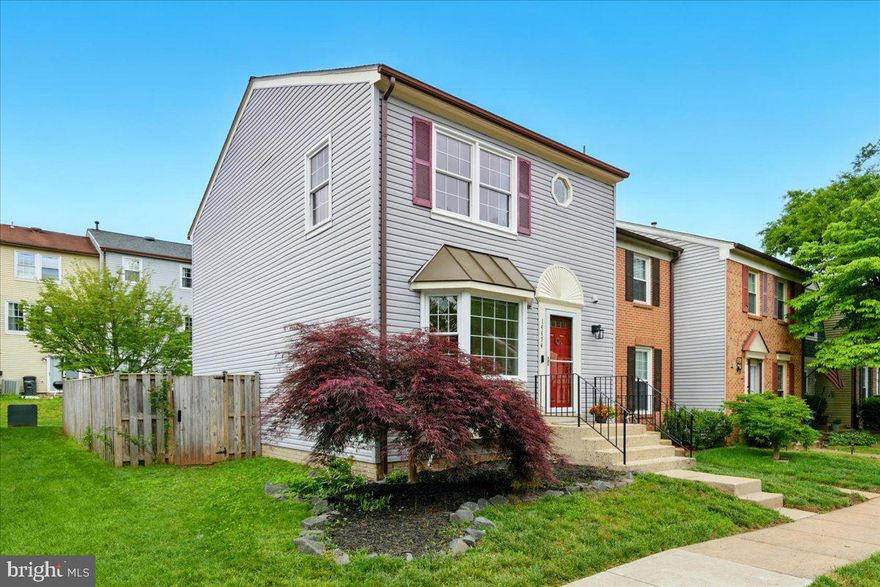 Twilight Open House Thursday May  8th 5-7pm and SATURDAY Open House May 10th 1-4pm. Welcome to this charming end-unit townhome!  As you step inside - hardwood floors carry you through the home. Neutral and pristine and filled with natural light. The charming kitchen boasts sleek new granite countertops, miles of cabinets, newer appliances and a delightful breakfast area with sunny bay window. The dining room is a spacious and inviting space that leads to the open living room featuring space to entertain and access to the deck and fenced rear yard. Back inside, a half bath completes this level. Upstairs, the primary suite offers ample closet space and an updated full bath. Two additional bedrooms and a hall bath complete this level. The lower level of this home offers a rec room, a nook perfect for a home office, the laundry area and ample storage. Major updates include Roof 2018, HVAC (Trane) 2020, Hot Water 2014, New Vinyl Windows 2003, Humidifier 2022, LVP flooring in LL 2024, Kitchen Counter/Sink/Faucet 2025. Enjoy close proximity to major commuting routes, convenient shopping and neighborhood amenities to include outdoor pool, play grounds and walking trails. Two reserved parking spots are directly in front of the home. Welcome Home!