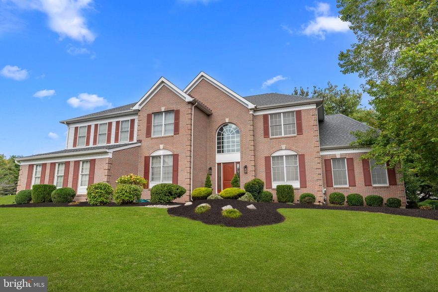 Welcome to this exceptional home nestled in the heart of historic Bucks County, PA. This elegant residence offers 4 bedrooms, 4 full bathrooms, and a powder room, blending timeless design with modern comfort. A grand two-story foyer with classic wainscoting molding sets the tone, leading to a thoughtfully designed open floor plan with hardwood flooring throughout the main level. The formal living room flows seamlessly into the dining room, creating the perfect space for entertaining. A stunning sunroom with walls of windows fills the home with abundant natural light, while maintaining a warm, neutral décor throughout. The main level also features a private study, a beautifully appointed kitchen with a breakfast area, and an impressive two-story great room highlighted by a floor-to-ceiling brick fireplace with propane gas logs. Dual staircases—including a rear staircase from the family room—add both convenience and architectural interest. Upstairs, the spacious primary suite offers a true retreat, complete with a sitting room, two large walk-in closets, and an opulent en-suite bath. Three additional generously sized bedrooms and two full bathrooms complete the second level. The fully finished lower level is designed for entertaining, offering multiple gathering areas, a wine cellar, and an additional full bathroom. Step outside to a picturesque setting featuring a large, maintenance-free rear deck—perfect for relaxing or hosting guests.  Additional highlights include a three-car garage and a stately brick front exterior all majestically set on .92 acres of land. Ideally located close to shopping, dining, and major conveniences, and situated within the award-winning Council Rock School District, this home offers the perfect combination of luxury, location, and lifestyle.