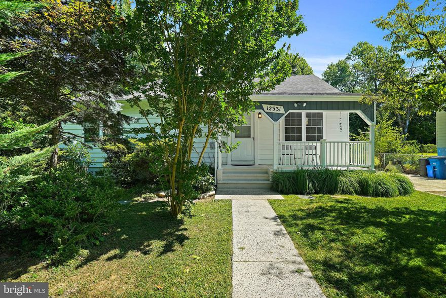 Calling all nature lovers! This charming Cape Cod with front porch on a corner lot is bursting with possibilities! Picture this: You pull into your own driveway, mature trees casting cool shade, and step out onto a beautifully landscaped haven. But wait, there's more! This fully fenced backyard is your own private oasis, perfect for summer barbecues or letting the fur babies roam free.  And get this – you're just steps away from the serene beauty of Winding Creek Park and the adventurous Rock Creek Trail! Feeling a little less outdoorsy today? No problem! Metro and bus stops are close making shopping, entertainment and the city easily accessible.  Now, let's talk about the inside! This home includes an upgraded kitchen that'll make your inner chef swoon. Plus, there's a finished basement with its own in-law suite, complete with a second kitchen – perfect for extended family or that dream home office with serious kitchen cred!
Upstairs, two spacious bedrooms await, including a luxurious primary suite with a private deck – imagine waking up to a cup of coffee and the gentle Maryland sunshine streaming through the trees. Entertaining? The light-filled living room is an absolute dream, and a versatile office space easily transforms into a formal dining room for those special occasions. This gem won't last long, so schedule your showing today! This is the home you've been waiting for!