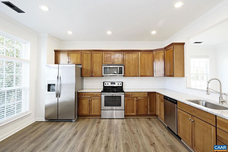 Located in the heart of W Albemarle Co, this dog-friendly 3 bedroom, 2.5 bath end-unit townhome sits in the desirable Bargamin Park community, surrounded by quiet, walkable streets, Blue Ridge Mountain views, and convenient access to all the best of Crozet. Enjoy being just minutes from downtown Crozet?s local shops and restaurants, as well as Claudius Crozet Park, Mint Springs Valley Park, and nearby wineries, breweries, and orchards.  Inside, this recently updated 1,642 sqft townhome features LVP flooring, high ceilings, and a light-filled, open layout on the main level. The spacious kitchen includes granite counters, stainless steel appliances, and room for a movable island or small breakfast table. The adjoining dining and living areas are filled with natural light and accented by built-in shelving. A half bath completes the main floor.  Upstairs, the primary bedroom offers a walk-in closet and a private full bath. Two additional bedrooms, a full hall bath, and a convenient laundry closet complete the second level.  Step out to the large covered rear patio - an ideal place to enjoy your morning coffee or relax in the evening. The patio opens to an expansive common green space with nearby mountain views.