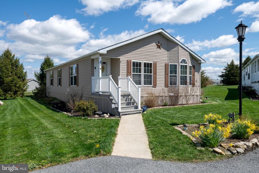 This bright and airy 3 bedroom, 2 bath home has arguably one of the best lots in the community! Offering privacy, gardening beds, a shed and a gorgeous screened porch to enjoy three seasons, it's in an ideal location! Well-maintained and  freshly painted with upgraded LVP flooring,  newer carpet, new screened porch with new storm door,  maintenance-free decking and railing on front porch, new water heater 2020 - simply move in and enjoy. Village at Greenfield is quiet but centrally located, offers many community events and has access to the Greenfield Estates indoor/outdoor community pools.