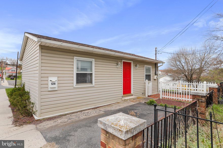 Just one block from the college and a couple blocks to Historic Frostburg Main St. you're in for the best and easiest access to education and entertainment that this part of Mountain Maryland offers.  Live big with the flexible space that offers dining, living, kitchen or home office with an open living concept. The second room makes for a spacious bedroom with room to spare for plenty of desk space or a comfy reading nook. Enjoy a bit of upscale finishes with a kitchen featuring glass backsplash, bath with granite vanity top, easy care luxury plank floors and even the convenience of a washer and dryer. Moving outdoors, the classic brick patio offers a relaxing space, and you even have off street parking. Experience the easy care that this move in ready "just the right size" home offers. Be ready to enjoy or rent right away with all appliances conveying and some furnishings too.