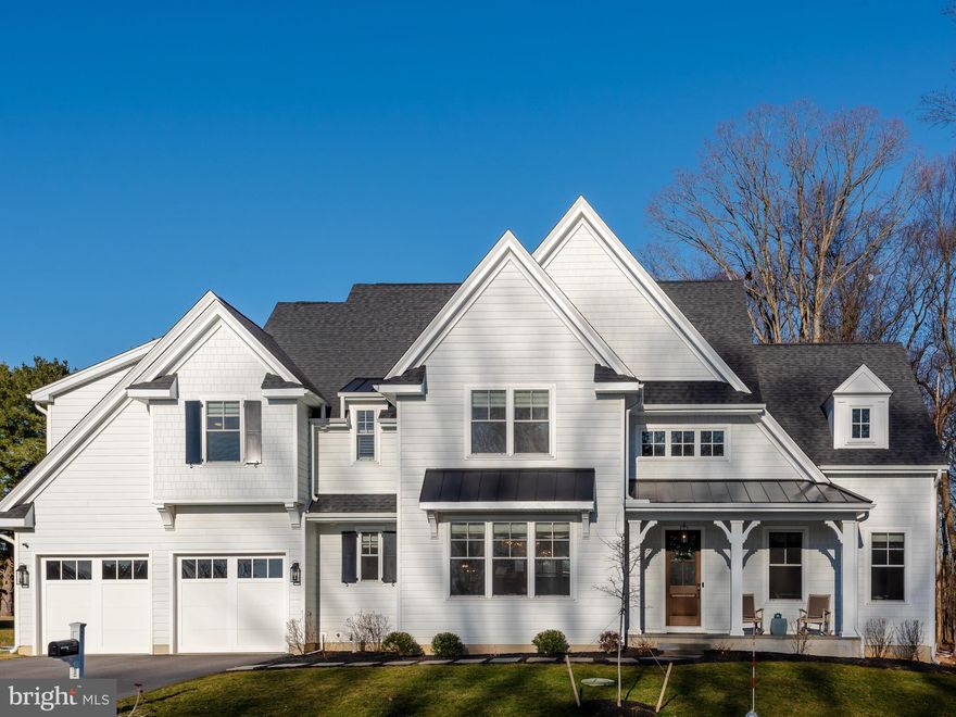 Welcome home to 202 Walnut Tree Lane in the desirable community of Troutbeck Farm in Malvern.
Award-winning Moser Homes built this lovely home in the highly-ranked Great Valley School District. This
home is the best of both worlds as it's newer construction (2022), yet it is move-in ready so there is no
long wait period before moving in.
Enter this home into a welcoming foyer with high ceilings throughout, an open floor plan, and beautiful
hardwood floors. The lovely living room is accented to the right by a wood-feature wall, fireplace, and
crown molding. To the left is the formal dining room with wainscoting, crown molding, and a chandelier to
compliment your entertaining with family and friends. The inviting family room is straight ahead from the
foyer, filled with natural sunlight, a wood-feature wall, and a stone mantel with stone surrounding the
fireplace and highlighted with a wood beam ceiling. The large office is located off the family room. There
are two sets of french doors leading into the office and a slider leading to the private rear deck. This
spacious room offers comfort and privacy for working from home. The magnificent gourmet kitchen is
open to the family room. This kitchen boasts gorgeous quartz countertops with subway tile backsplash,
custom soft close cabinets, a large pantry, high-end Bosch appliances with gas cooking, and a large
center island with pendant lighting for all your entertaining needs. There is a beautiful boxed shiplap
ceiling over the kitchen island. The generous-sized yet cozy breakfast room sits at the rear of the kitchen
and overlooks the tree-lined backyard with sliders to the oversized deck. A favorite feature is the butler
pantry located between the kitchen and dining room with a wet bar and Bosch beverage cooler. There is
plenty of storage and a beautiful custom backsplash that complete this space. This is a perfect
compliment for entertaining. The first floor also has a powder room with a large vanity. There is a
thoughtfully designed mudroom with shiplap, a large closet, with a bench, and built-in cubbies
Upstairs, the primary bedroom is warm and spacious with plenty of natural light and two large walk-in
closets. The closets have been custom-finished with shelving and drawers. The primary ensuite has a
separate soaking tub, a tile shower with dual showerheads, two individual vanities, and a linen closet.
Three additional bedrooms are on the second floor. One bedroom has a private bath, perfect for guests.
The other two spacious rooms share a bath between them. All have plenty of custom closet space. The
laundry room with a utility sink and cabinets is also located on this floor.
The lower level is nicely finished and can be used as a playroom, gym, or an additional family room.
There is also a spacious, unfinished room for all storage needs. A powder room, already plumbed for a
shower if desired, finishes the lower level. The location of this home is convenient to shopping,
restaurants, and major roads and transportation leading to West Chester, Malvern, King of Prussia,
Philadelphia and more. It is a must see! (See list of upgrades in documents)