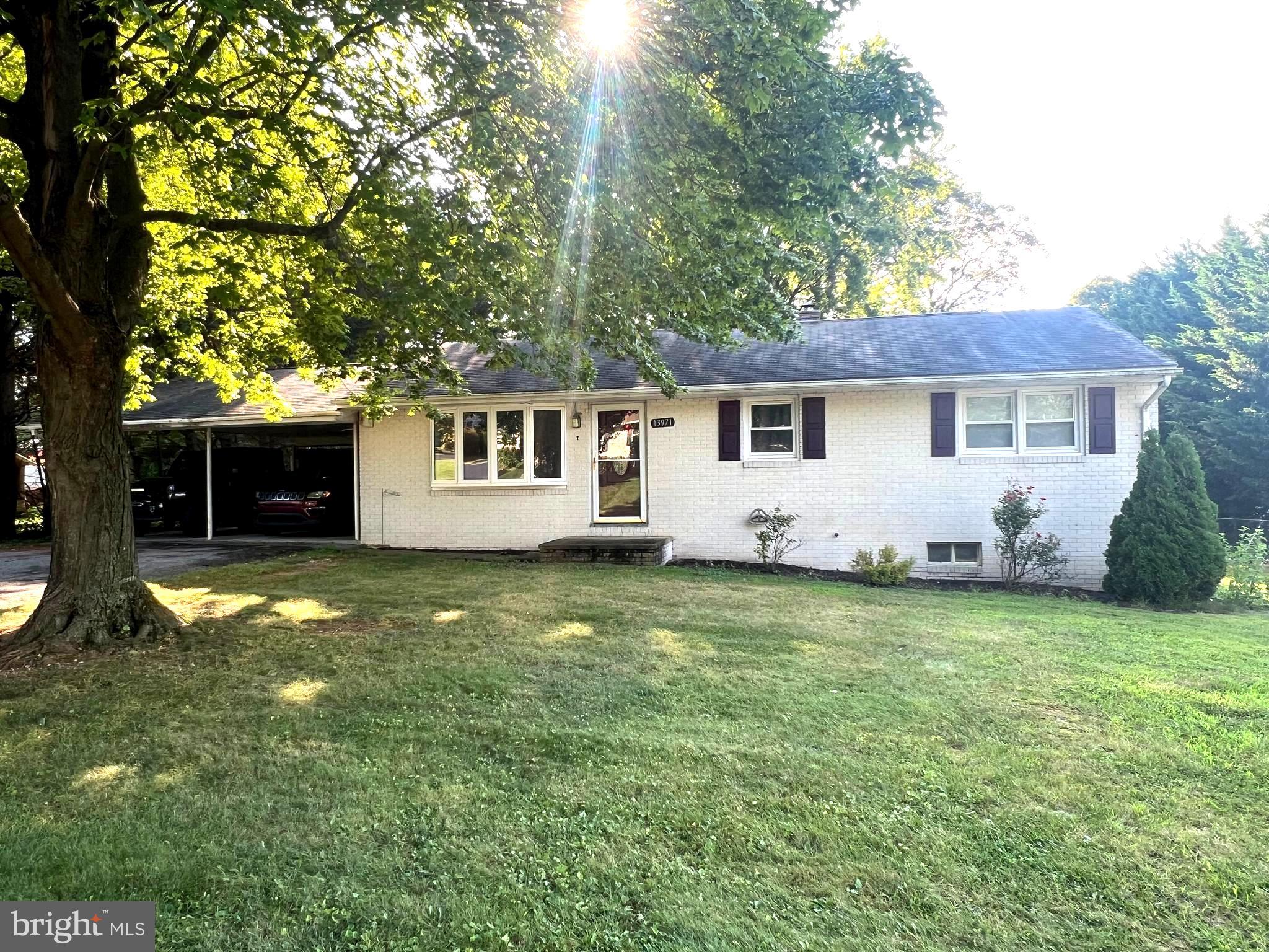 Come check out this affordable home and see what you think. Located in quiet neighborhood in a country setting. The home features 3 bedrooms, large living room, dining area and functional kitchen. Hardwood oak floors. Why pay rent when you can own. The lower level features a sports rooms with bar area and extra refrigerator. Front load washer and dryer stays as well as an Upright freezer. Privat back yard with covered patio and large deck. 2 car carport to keep you vehicles safe and dry. Don't wait to see this home, it is priced to sell and won't last long. Set up your showing ASAP.