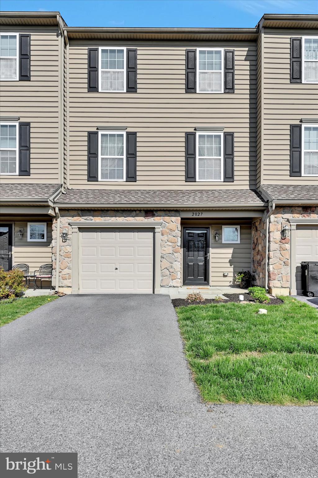 BACK ON THE MARKET. Buyer financing fell through. Welcome to 2027 Crown Mill Drive, a charming townhouse nestled in the serene Parkside Planned Community of Mohrsville, PA. This inviting 3-bedroom, 2 full bath and 2 half bath home offers thoughtfully designed living space, combining modern comfort with a peaceful setting.
This home has been completely updated and renovated by the owner, using high levels of craftmanship. Every inch of this property shows pride of ownership and is a truly ‘move-in ready’ home. Throughout the house you will see evidence of the detail-oriented workmanship.
The lower level has been finished to a high standard and features a spotless garage (dry walled and painted!) with built-in storage, a large family room and a convenient half bath.
The main floor features an open-concept layout with a bright living room, dining area, and a well-appointed kitchen—ideal for entertaining or relaxing with family. A second half bath is available for additional convenience.
The upper floor has a generous sized owner’s suite complete with a walk-in closet and en-suite bathroom, providing a private retreat. Two additional bedrooms share a full hall bath, offering comfort and privacy for family or guests. The laundry room is conveniently located on the upper level, adding to the home's functionality.
Enjoy the outdoors from the rear deck, which overlooks a wooded area, offering a tranquil setting for relaxation.