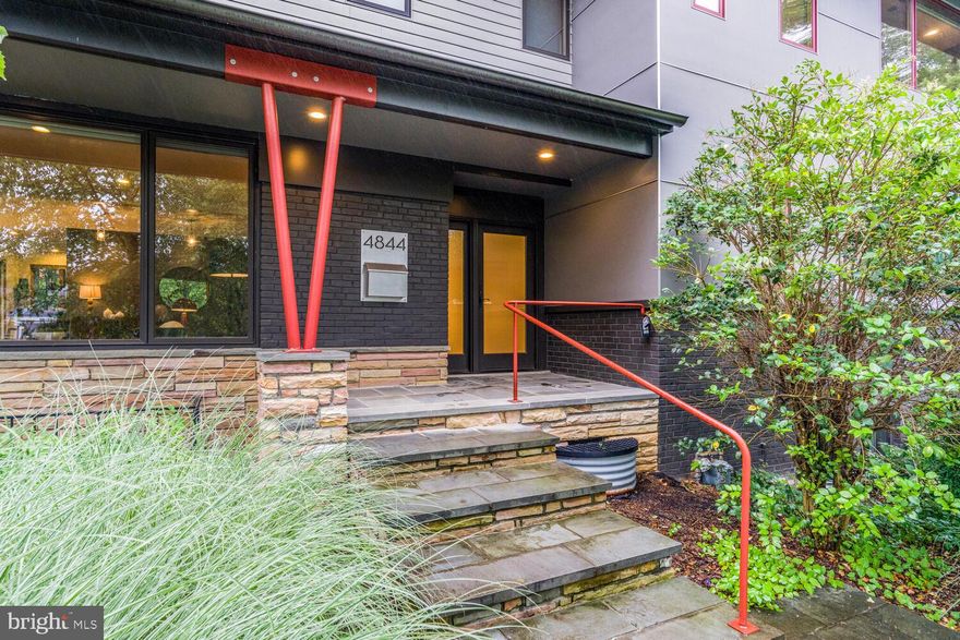 A Modern Masterpiece in Arlington
Welcome to 4844 Yorktown Blvd, where modern design meets timeless craftsmanship. Set on a sprawling 0.41-acre lot, this 6-bedroom, 5.5-bath home redefines luxury living with an exquisite fusion of form and function.
Originally built in 1953 but completely reimagined in 2014-2015, this home is practically new, featuring impeccable green-building insulation and custom Weathershield windows. Inside, 5,300 square feet of meticulously designed space unfolds, offering soaring 9’ ceilings, rich wood flooring, and an effortless flow between living spaces.
At the heart of the home, the large Irish-style kitchen is designed for both cooking and connection. It features a spacious hangout area, matte Silestone counters, a Thermador range, Sub-Zero fridge and freezer, Bosch dishwasher, and a sleek European island hood. Vast windows offer light from the south, while the space opens seamlessly to a flagstone patio on the east and a deck on the west. Custom black steel accents add a bold touch, while a built-in bar elevates the dining space. The open-concept layout extends to a light-filled living room with custom bookshelves, a striking mantle, and one of two gas fireplaces.
The home features both a main-level and an upper-level primary suite, each with spa-like baths adorned in Patricia Urquiola accent tiles, Silestone counters, and Italian porcelain. The expansive primary suite boasts a custom wardrobe-style walk-in closet. Upstairs, three additional bedrooms share two beautifully appointed bathrooms, one with a tub and one with an expansive shower.
Outdoor living is just as captivating with a large flagstone patio, a separate deck, and beautifully landscaped front and back yards featuring native river oaks, grasses, and succulents. A generous 600 sq. ft. side-loading garage and a wide driveway provide ample parking.
Designed for both grand entertaining and everyday comfort, this home is a rare find in Arlington, a modern architectural statement in a class of its own.