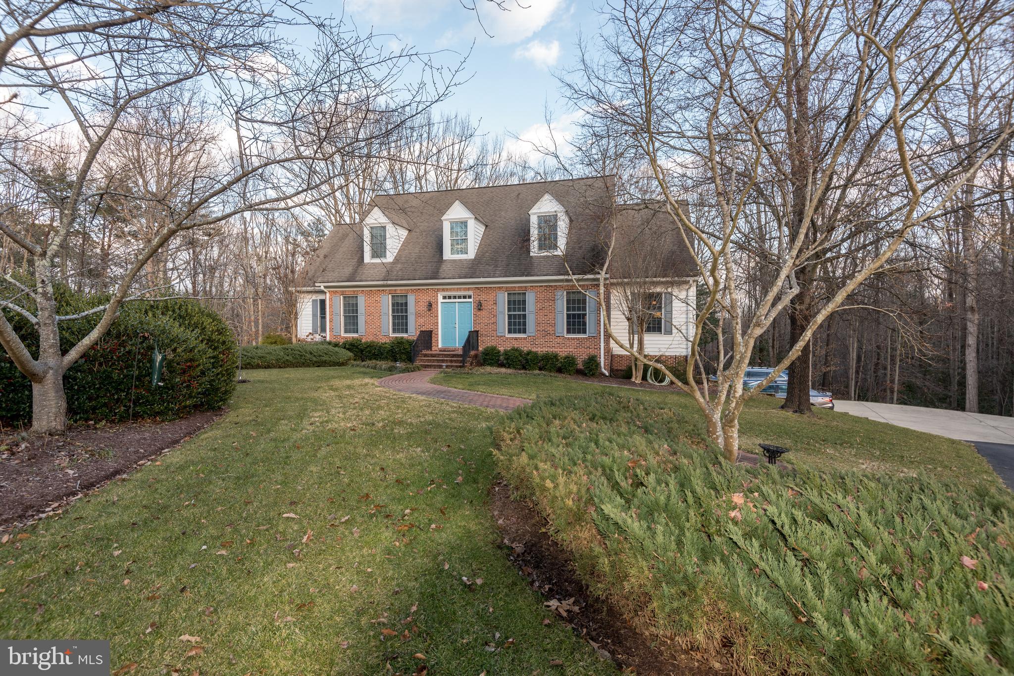 This home is a must see. Cape Cod Brick front located on 3.42 acres in the Avenmar Community in Breton Bay. Beautiful wide plank maple hardwood floors. stunning Williamsburg style complete with interior brick walls, 10 foot ceilings, and beautiful moldings. First floor master suite with stunning master bath with soaking tub. First floor office. Separate dining room with large windows overlooking the expansive deck, woods, and equestrian trails. HVAC replaced 8/2019. Cooktop replaced 2019. All carpets cleaned 2021. Avenmar Community has club house with full kitchen, pool, equestrian with available lessons, tennis court, outside volleyball court, community pier with kayak storage. Breton Bay Golf Course nearby. Does not require membership.