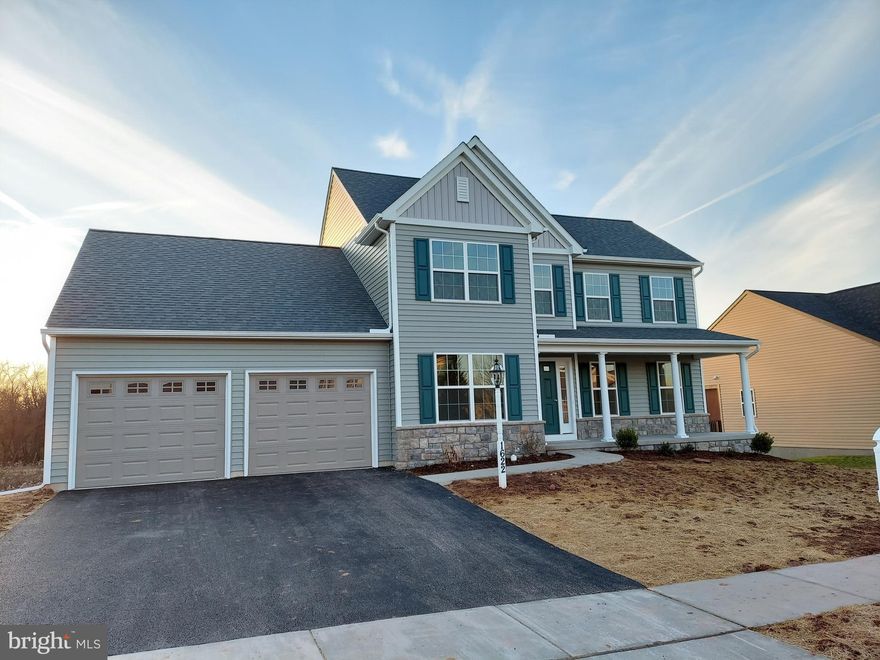 BUILD JOB! Home is being built to buyer's specs.  This MLS listing is a beautiful 4BR, 2.5BA Warren Model classic elevation featuring stone to windowsill height, and full covered front porch w/columns.  It showcases over 2400 sq ft of elegant living space, a full walk-out lower level and 2-car garage. Fall in love with the open and flowing first floor, with eat-in kitchen that is open to the family room. Buyer added hardwood floors to the kitchen & breakfast area, hallway, powder room and walk-in pantry.  Enjoy the first-floor owner's suite with pocket door to the retreat bath including a free-standing bathtub, 4' walk-in shower, ceramic tile floors and double bowl sink.  A laundry room, powder room and walk-in pantry closet are located off the kitchen.  Upgrades in the kitchen include quartz countertops, ceramic tile backsplash, upgraded cabinets, kitchen island, recessed lighting package & stainless-steel appliances. Three additional bedrooms, all with walk-in closets, and a hall bath with double bowl sink, are located on the 2nd floor.  A full walk-out lower level, with Superior Walls, is the perfect place for future expansion and includes extra electrical work and sliding doors to concrete pad and yard.