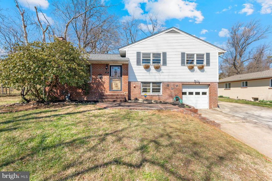 This home is much larger than it looks with 2368 square feet on 4 finished levels. Features include 1-car garage, hardwood floors, and wood burning fireplace. The spacious kitchen has a lot of storage with solid wood cherry cabinets. Private lower level family room with custom built-ins. Enjoy over half an acre of outdoor space- backyard has tiered levels with brick patio, and 2 sheds for storage.  As you take the steps up the hill, it's like an additional backyard with a gazebo that has electric and koi pond waiting to be brought back to life. Newer roof. Estate sale in good shape but ready to make into your own! Central air on upper two levels only. Check out the virtual tour!