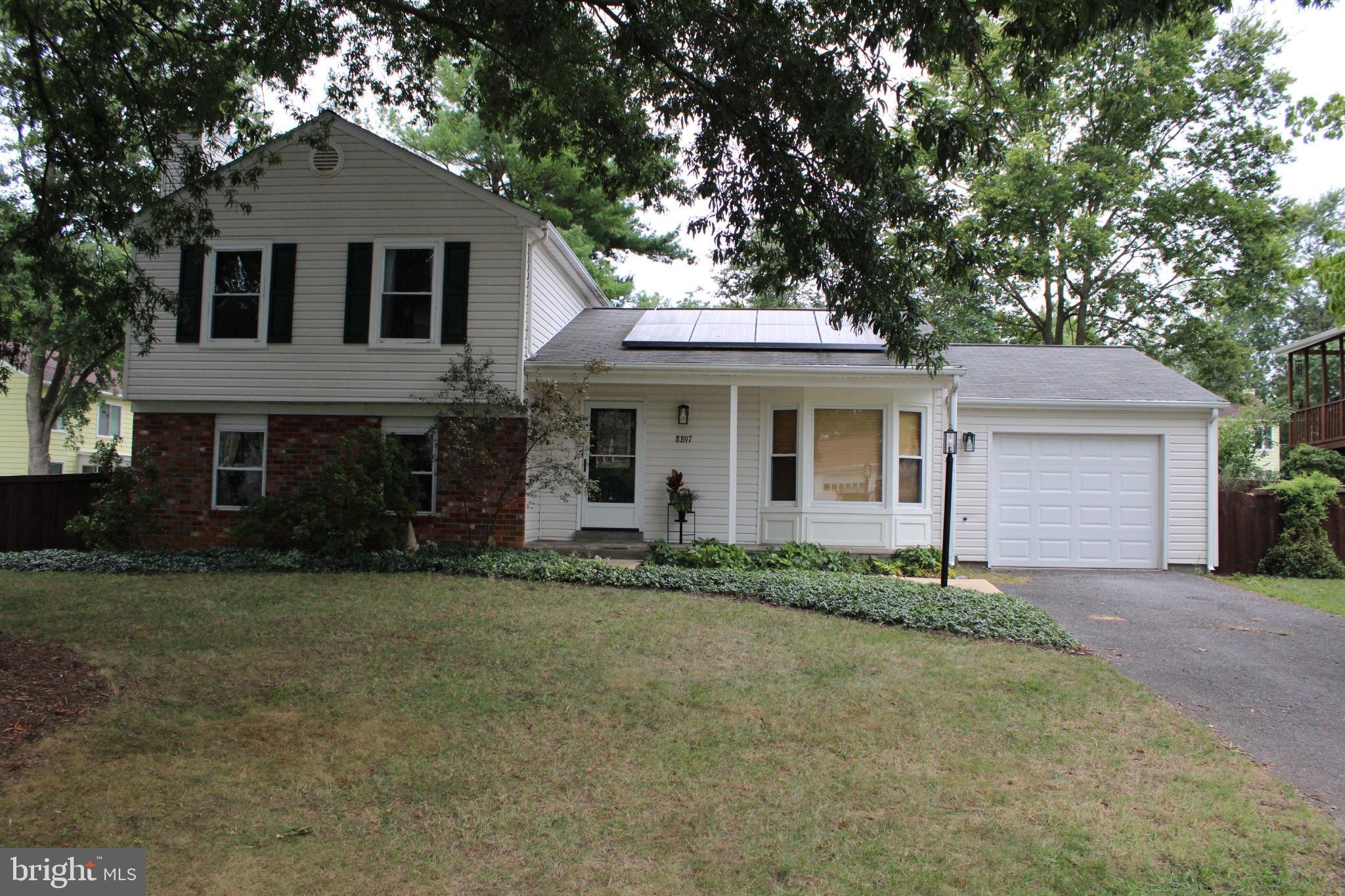Come and see this lovely, updated and freshly painted split-level home, situated in a cul-de-sac! It has 3 bedrooms, 2-1/2 baths, and a 1-car garage. The home features a galley kitchen Shaker-styled cabinets, granite countertops and a charming eat-in area with Bay window seating. Adjacent to the kitchen are the living room and dining room areas with sliding doors and windows providing a beautiful view of the well-manicured backyard. Additional living areas include a den with an electric fireplace, brick facade, and built-in bookcases. At the right side of the den are pocket doors that lead to a Bonus/Flex room with French doors opening to the backyard. The combination Laundry Room and Half-Bath is off of the Bonus/Flex Room. Upstairs there is a full Hall Bath with a tub and shower and two bedrooms. In addition, there is the Primary bedroom and bath with a shower. There is bamboo flooring throughout most of the home, tile flooring in the bathrooms, and brand-new carpet in the bedrooms. There are ceiling fans in the bedrooms, kitchen, and bonus/flex room. There is also updated LED ceiling lighting in the kitchen, living area, and den. The backyard is fully fenced with dark wood and features a concrete patio and beautiful landscaping. All exterior lighting has been replaced, and the garage door is also brand new! The home includes leased solar panels and a heat pump that is barely a year old. This home comes with access to walking trails and optional access to the community pool. Don't miss out on seeing this gem by setting up your viewing appointment ASAP!
The seller, after having completed numerous updates, is selling the property "AS IS" except for the driveway which is scheduled to be repaired and repaved.
Seller requests all visitors wear the provided disposable shoe covers while viewing the home. Shoe covers are located immediately to the left upon entering the front door.