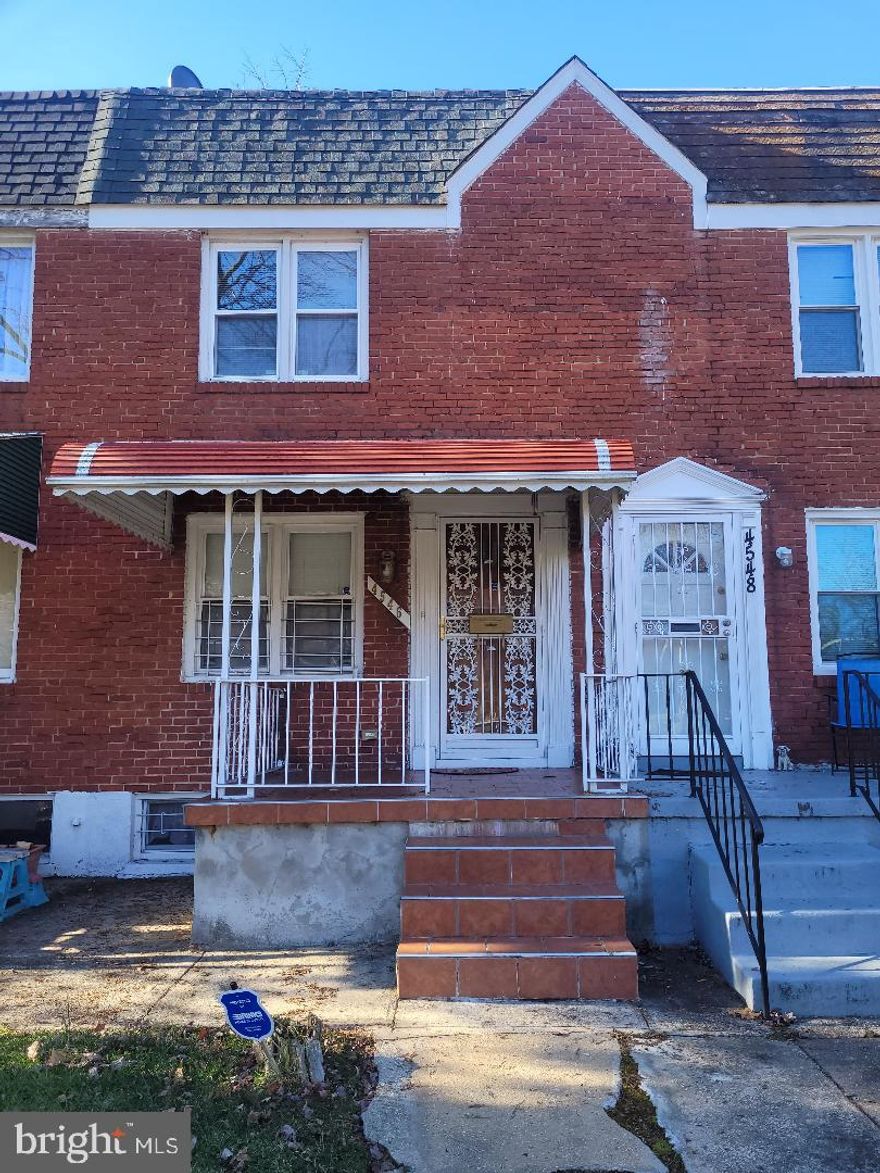 Great Covered Front porch, brick, 2 bedroom 1.5 bath home.  Beautifully refinished hardwood floors on the main level.  Updated White Cabinet Kitchen with granite counter tops, stainless steel appliance package, and gas stove.  Windows offer lots of lighting throughout the home.   Security doors on front, rear and basement.  Fenced rear yard and concrete finish for maintenance free living.  Recent rubber roof added and skylight in upper bathroom.  Basement has two storage areas, washer, dryer, family room and half bath.   Central A/C with newer compressor, ceiling fans and forced air gas heating.  Home is move in ready and needs very little maintenance to upkeep.  Property located near public transportation, shopping areas and medical facilities.  Priced to sell and immediate availability.  Schedule a tour for your buyer today.