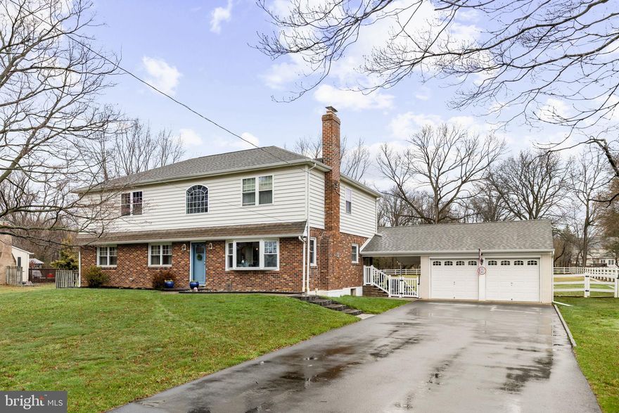 Set on a spacious, level 1-acre lot in desirable Warrington, this beautifully expanded 5-BR home offers the perfect blend of classic charm and modern updates. Thoughtfully enhanced with a full second-story addition, the home now doubles its original living space while maintaining a highly functional layout for today’s lifestyle.

The first floor has been completely reimagined, featuring rich hardwood floors, detailed molding, and stylish modern fixtures—all carefully curated by a professional designer to ensure perfect color, lighting, and hardware choices. A welcoming living room, centered around a cozy wood stove, flows into the updated kitchen, which boasts granite counters, porcelain tile floors, stainless steel appliances, and tons of natural light. The adjoining dining area and comfortable family room create seamless spaces for gatherings. A first-floor bedroom and a remodeled full bath with marble sink and tile offer flexibility for guests, a home office, or convenient main-level living.

Upstairs, the spacious primary suite serves as a private retreat, complete with a large walk-in closet and a well-appointed en suite bath featuring double sinks, a soaking tub, and a separate shower. Three additional bedrooms and a full hall bath complete the second floor, Three of the four upper-level bedrooms have walk-in closets.

A full basement adds extra space for storage or projects. Outside, the expansive, fenced yard is complemented by impressive hardscaping, including a covered patio—perfect for outdoor entertaining. An oversized two-car detached garage adds both convenience and functionality.

With its generous space, designer-perfect finishes, and exceptional outdoor setting, this home is comfortable, modern, and ready for the next chapter.