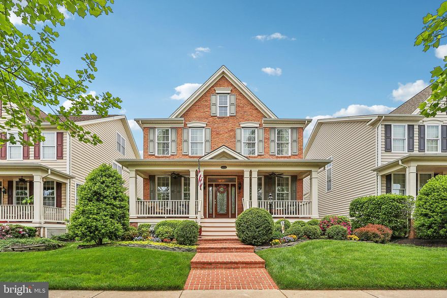 Spectacular home that has been meticulously maintained with hardwood floors and custom paint and window treatments throughout*Incredible kitchen with granite and new stainless appliances including 5 burner cooktop and Butler's pantry with wine fridge*Custom sliding door leads to large deck and patio*Large family room with gas fireplace*Upper level features huge master suite with built ins and luxury master bath*Large secondary bedrooms and 2nd full bath on upper level*Finished lower level with newer luxury vinyl plank flooring offers a large recreation room, 3rd full bath, separate pool table area with wet bar and ample storage*Curb appeal is amazing with front porch and beautifully landscaped yard with underground sprinkler system*Enjoy all of the Dominion Valley Country Club amenities including 24-hour security, pools, fitness facility, tennis courts, clubhouse and more! Super convenient to major commuter routes and shopping!