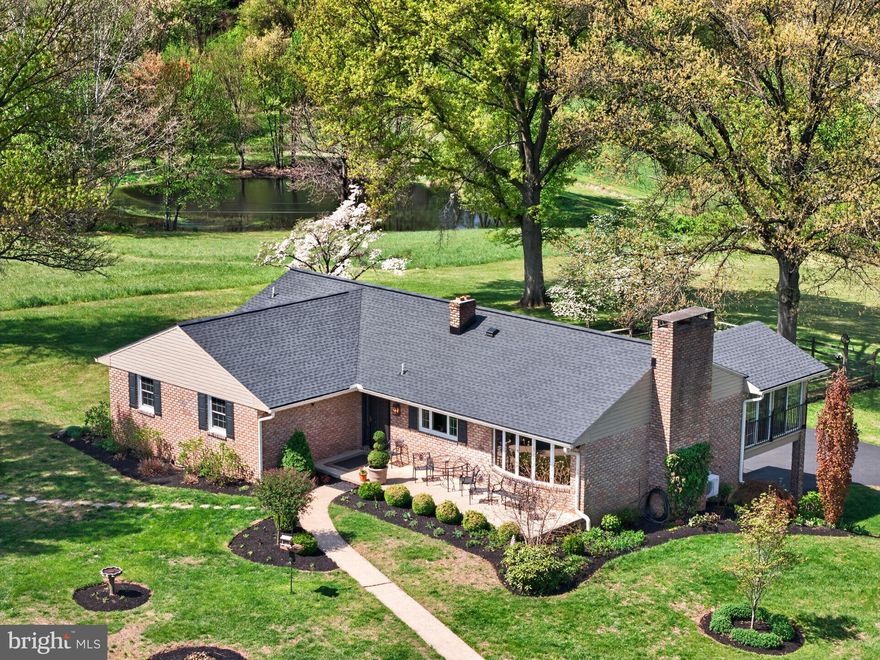 Welcome to "Pin Oak Hill" set on 16.36 scenic acres in Union Township, this custom built home is its first time on the market! This beautifully maintained ranch home offers a rare combination of privacy, quality upgrades, and picturesque surroundings. A long, tree-lined driveway creates an impressive approach, leading to a property highlighted by a stunning private pond and open grounds ideal for a variety of uses. The view you have of the field is preserved land.  The sunsets will be your favorite! 
You will be impressed with the $350k + in upgrades over the past 10 years. The main level features a thoughtfully updated interior with pine and hickory wood floors, a custom white kitchen with Viking refrigerator, GE Cafe Induction Cooktop with double oven, built in microwave cabinet, and three well-sized bedrooms. Nearly every aspect of the home has been improved, reflecting true pride of ownership. Bathrooms have been tastefully renovated and include heated floors for added comfort.
The finished lower level expands the living space with a fourth bedroom, full bathroom, and a spacious recreation room—perfect for guests, extended living, or flexible use.
Outdoor living is equally impressive, with hot tub patio, a Trex deck and a four-season sunroom equipped with its own split unit, allowing for year-round enjoyment of the property’s peaceful setting. Additional features include central air, a two-car attached garage, and an 1878 bank barn offering excellent storage or hobby potential, milk house and a wagon house.
A new roof installed in 2025 with a 50-year warranty adds long-term value and peace of mind. This is a truly special property that combines modern updates with natural beauty in a highly desirable location.