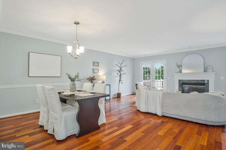 AMAZING LOCATION & Amazing Price ! Situated across from Fort Meade Army Base, just 2 miles from the AMTRAK/MARC train station, and about 6 miles from BWI Airport. Enjoy a short commute to NSA, Washington, D.C., Columbia, Baltimore, Annapolis, and major routes including 32, 175, 97, 100, 295, and 95. It’s also conveniently located near malls, shopping, restaurants, schools, and more.

AMAZING VALUE! The home features fresh paint throughout, new flooring in the kitchen and bathrooms, refinished hardwood floors, and new carpet in the bedrooms. 
This three-level contemporary garage townhome is situated on a lot with a deck off the upper-level living area overlooking open space and over 2,544 sq. ft. of living space. The lower level includes a recreation room (or 4th bedroom), access to the fenced backyard, a laundry closet, and a full bath—perfect as a private space for a teenager or family member who wants their own entrance.

The upper level boasts a spacious, light-filled living room with cherry hardwood floors, a wood-burning fireplace, and two French doors leading out to the brand-new composite deck with stairs. The level also includes a dining area, an eat-in kitchen with a pass-through window to the living room, granite countertops, a built-in island, stainless steel appliances, a tiled backsplash, a built-in butler pantry, and a half bath off the living room.
The bedroom level features vaulted ceilings in the owner's suite, a full bath with a shower, and two additional bedrooms, also with vaulted ceilings, and a shared full bath. Additional highlights include updated lighting fixtures, fresh paint, new carpet, and some updates to the bathrooms.

Enjoy all the amenities the Seven Oaks community has to offer, including an exercise room, four outdoor pools, two community centers, tennis courts, tot lots/playgrounds, walking trails, open spaces, a baseball/recreational field, and a bicycle playground! Well worth seeing!