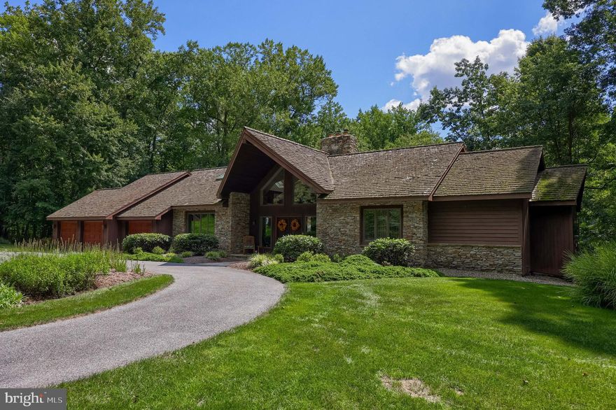 Discover this extraordinary home nestled on 3 total parcels. Great opportunity to build a home for family and friends or future investments.  Over 21 acres of a serene, park-like setting. A private circular driveway welcomes you home, leading to a private, peaceful setting. At the heart of the property, you’ll find a sparkling pond with a water fountain and floating dock, creating a breathtaking backdrop for everyday living. Multiple maintenance-free decks overlook the water—perfect for entertaining or simply unwinding in peace. Step inside the grand foyer where a soaring floor-to-ceiling fireplace anchors the open living areas. A formal dining room sets the stage for large gatherings, while the adjacent eat-in kitchen offers a sunny breakfast nook with panoramic views. The first-floor primary suite is a true retreat, featuring a spa-like bathroom with a jetted soaking tub, walk-in shower, dual vanities, and two walk-in closets. Convenient laundry room with additional storage, and a powder room. Upstairs, a loft space provides the perfect spot for a home office or hobby area. The walk-out lower level expands your living space with a welcoming family room complete with a wet bar—perfect for entertaining. Two generously sized bedrooms, each with their own private bath, provide comfort and privacy for family or guests. You’ll also find a convenient powder room, abundant storage, a dedicated workshop, and direct garage access—ideal for boat or equipment storage. Car enthusiasts will appreciate the attached three-car garage with an electric car charging port and automatic openers, in addition to the lower-level garage for recreational storage.
This home offers a lifestyle surrounded by nature, privacy, and comfort. As well as many energy efficient upgrades to include dual zone - geothermal heat and cooling, whole house generator, and even a custom dumbwaiter for the wood stove.