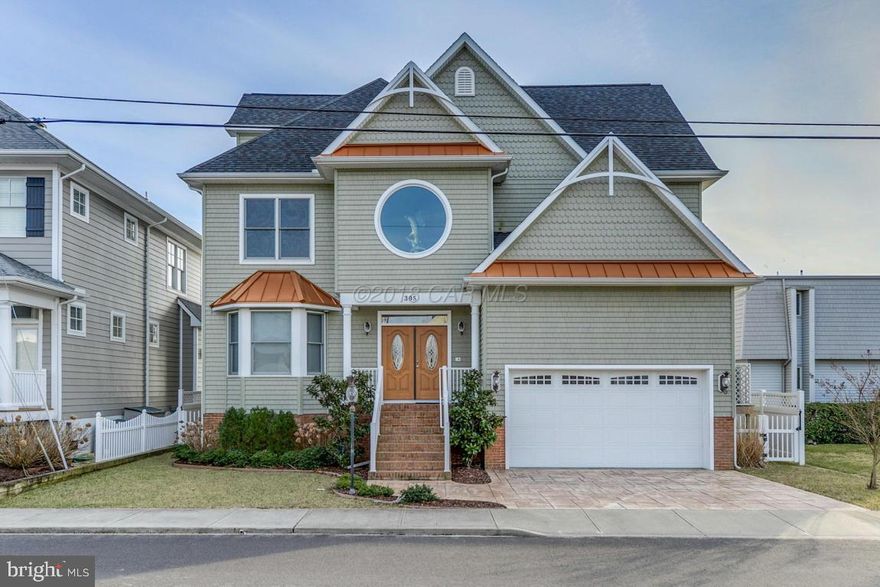 This stunning 3 story, South facing, DIRECT Bayfront home, custom built in 2009, in the quiet Caine Keys II community, provides not only gorgeous Sunrises and Sunsets, but also 3777 square feet of space for a large family or guests.  The freedom and convenience to keep your boat lifted behind your home ready for the days you want to go out on the bay or enjoying your POOL while soaking in the Sun on your back deck or walking 1/2 mile directly to the Beach and Ocean are just a few of the ammenities of living here.  This home is elegant, boasting high ceilings, a fireplace and an amazing 3rd Floor ''LOUNGE'' that will take your breath away.    This is a must see for anyone looking to get the